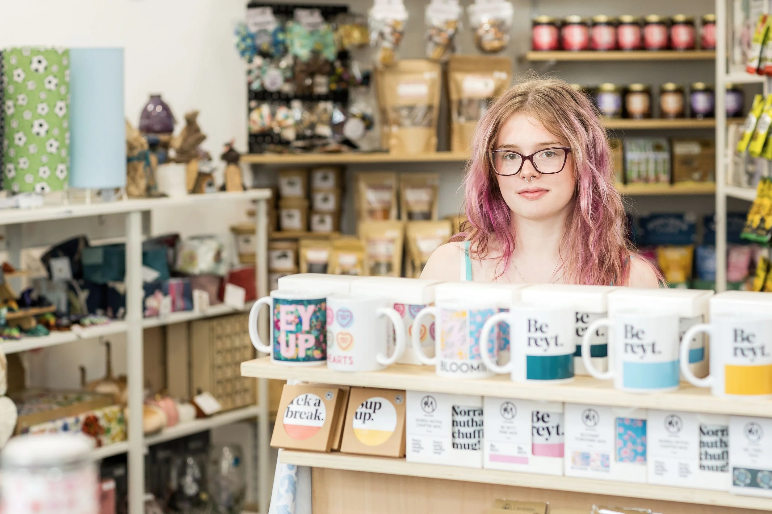 behind a shelf of Yorkshire mugs at Simply Divine Things