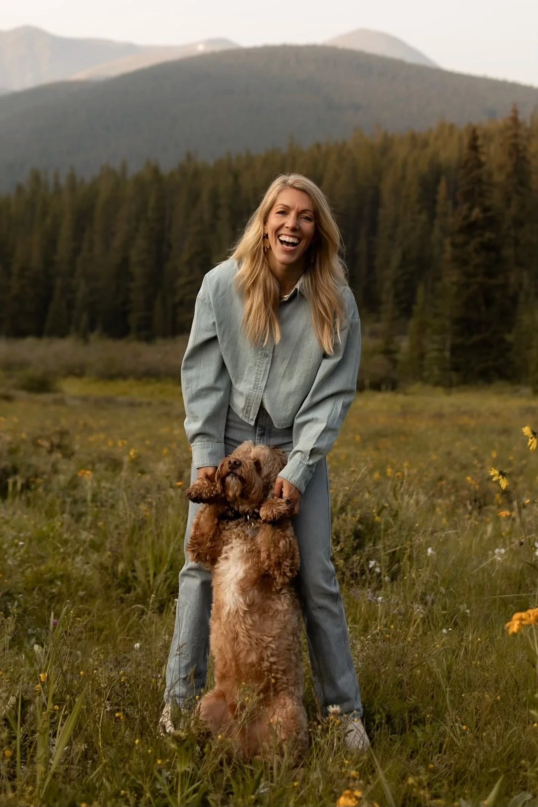 Sarah with her dog in the open fields.