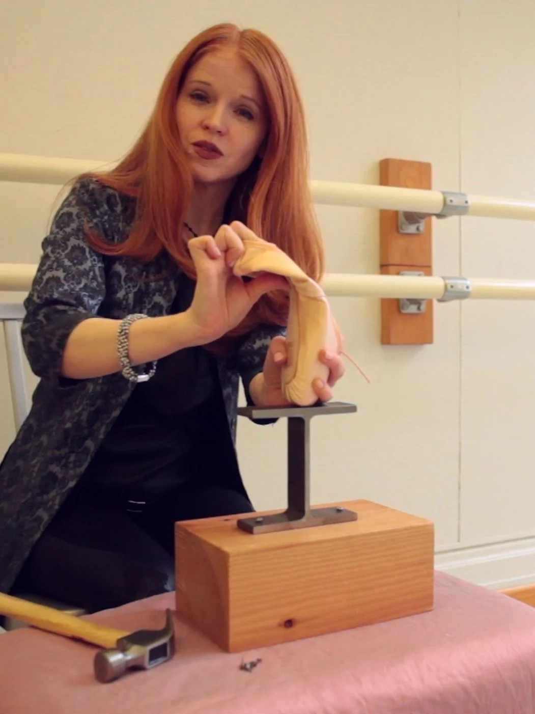 Mary Carpenter bends a ballet shoe in half