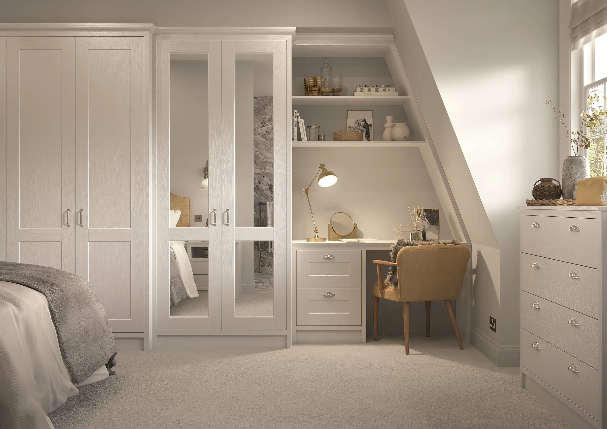 Stori bedroom with white built-in storage units and a desk area. The decor is neutral with warm tones, a window on the right letting in natural light, and decorative items such as vases, books, and a mirror on the desk.