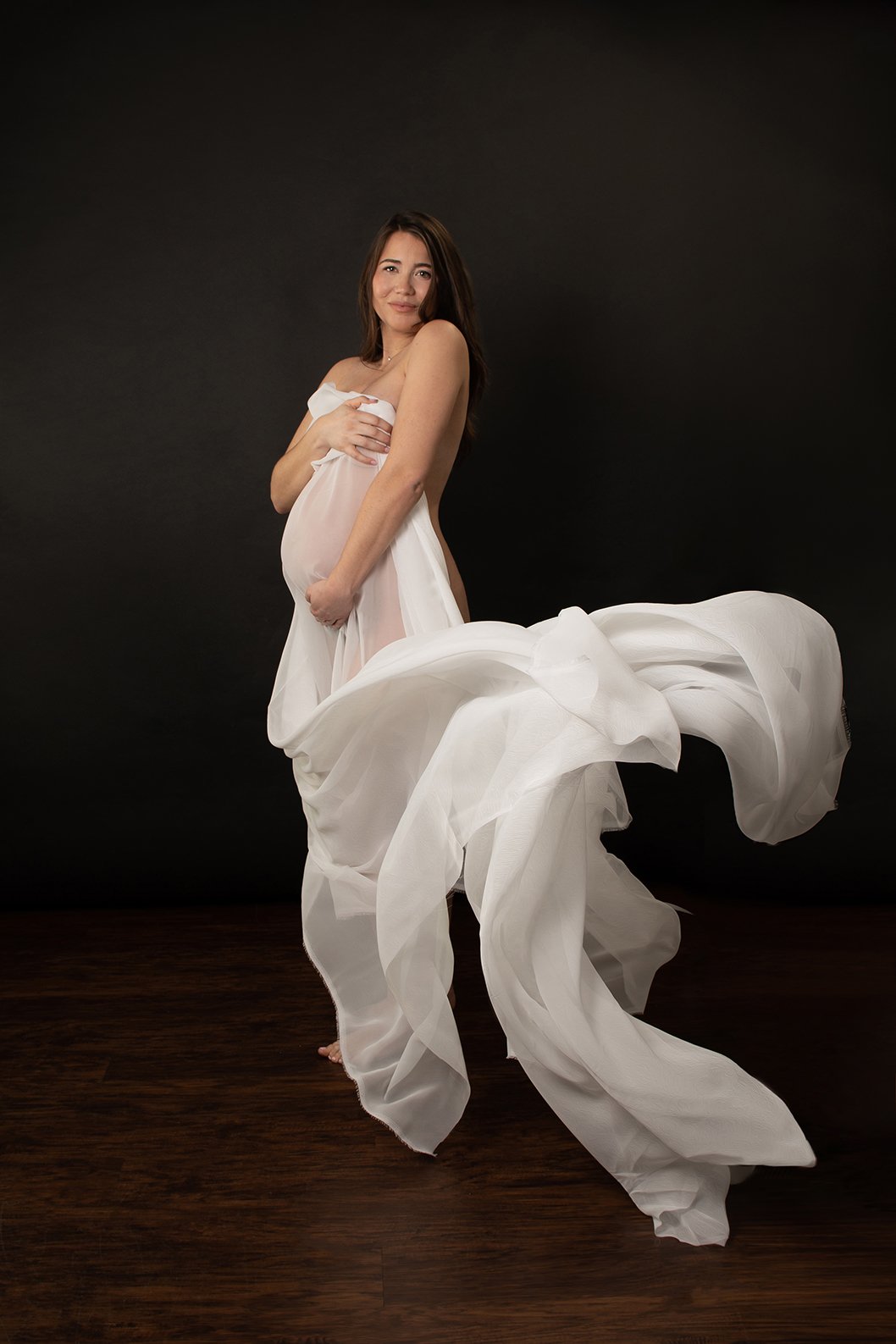 Ethereal Maternity Image woman in sheer white drapery pregnancy portrait Winter Park Florida Rinat Halon