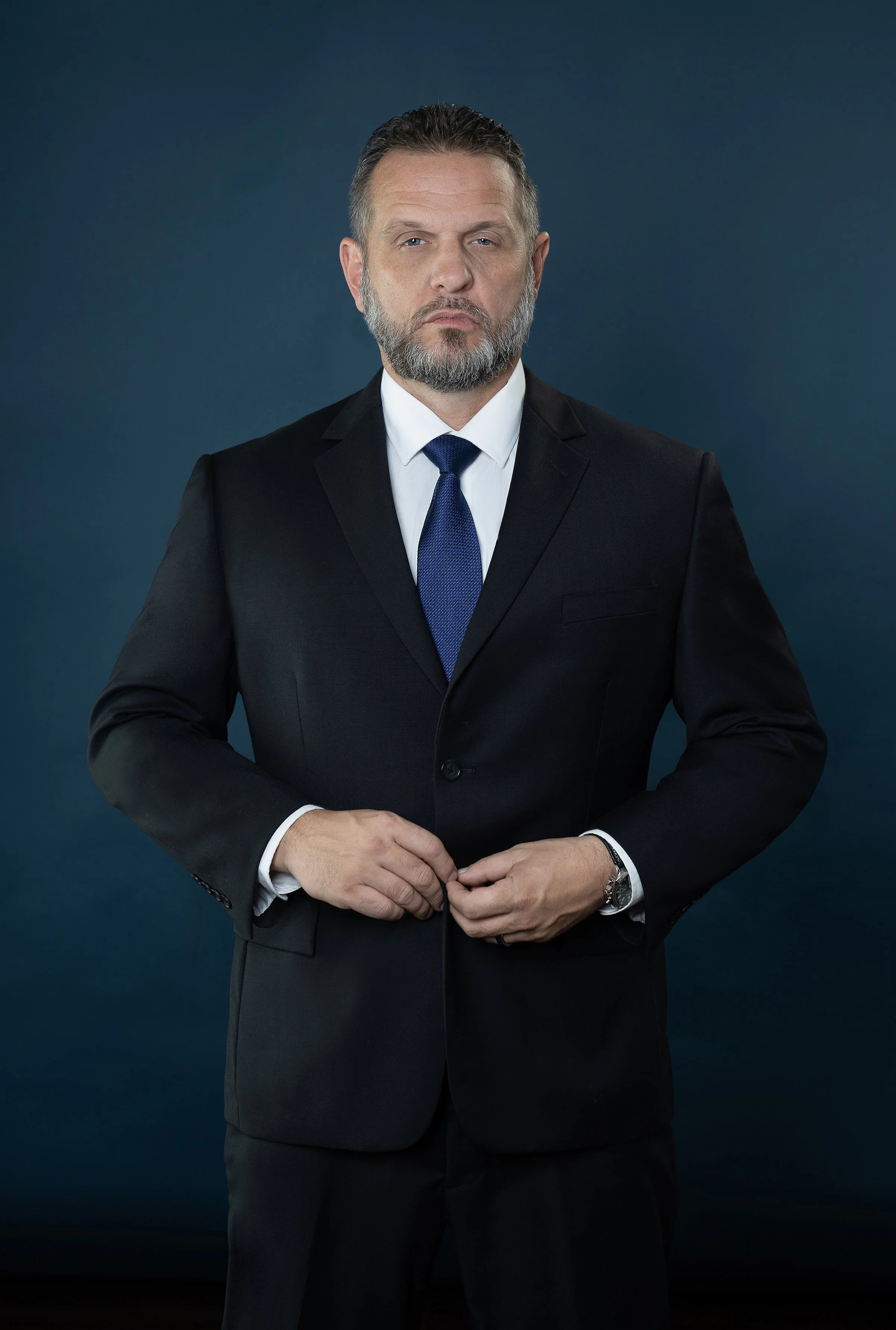 man in suit on blue background
