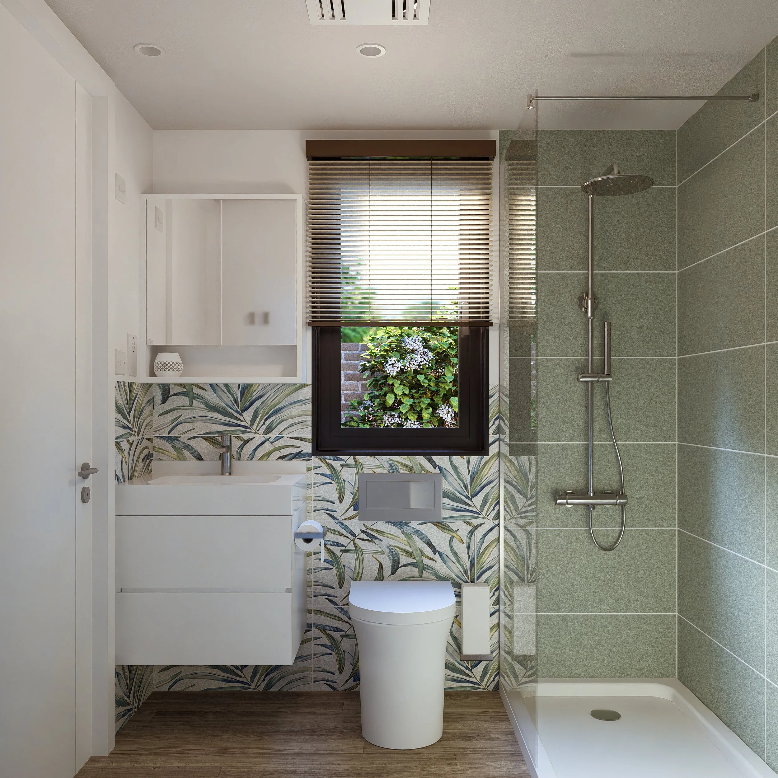 Bauhu hurricane resistant modular home bathroom with green tiled shower, white toilet, vanity with sink, small cabinet, and a window with blinds showing outside greenery.