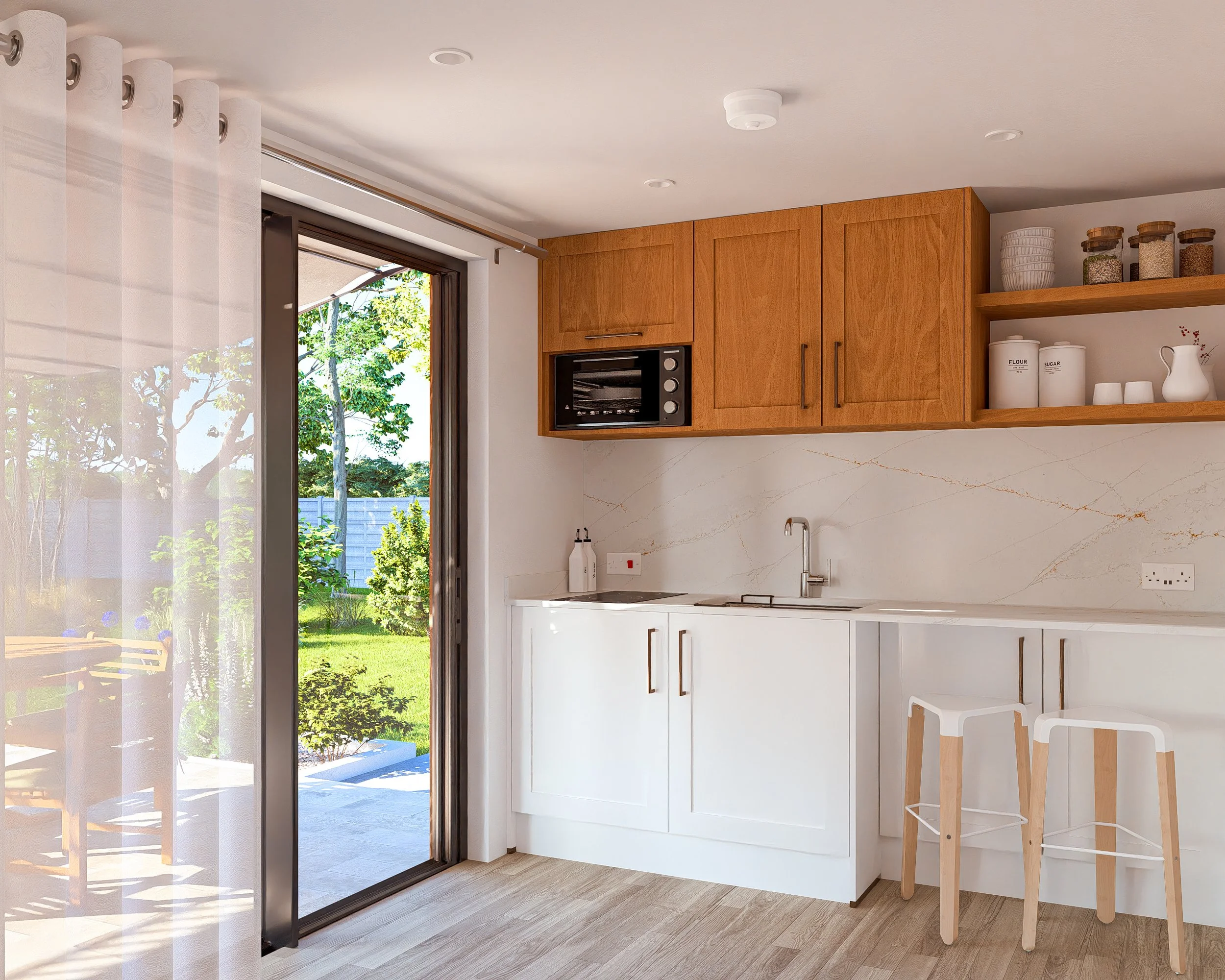 Bauhu hurricane resistant modular home kitchen with white cabinets, wooden upper cabinets, and a marble backsplash. A sliding glass door opens to a backyard with green grass and trees.