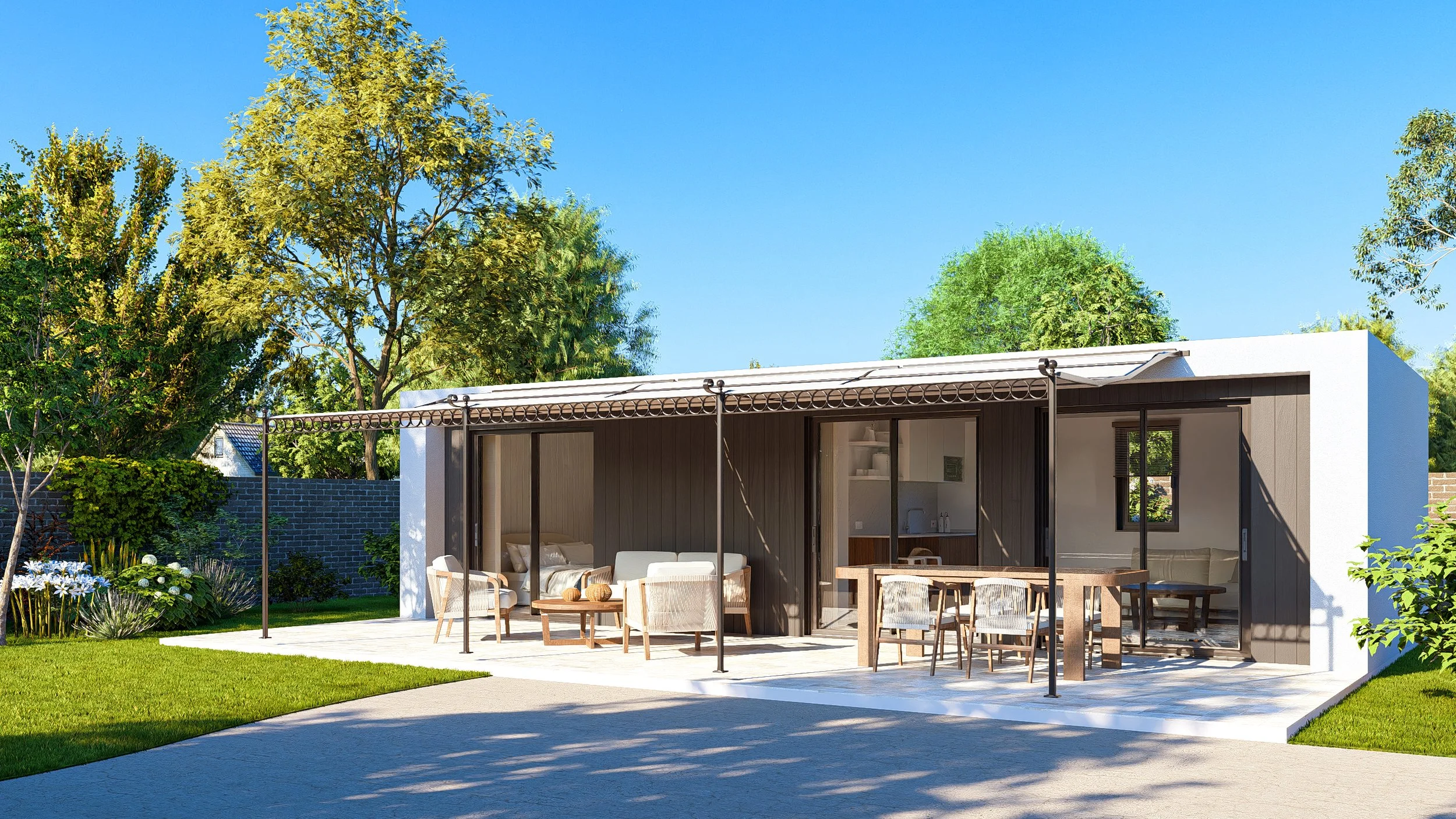 Bauhu hurricane resistant modular hospitality pod  single-story house with large glass sliding doors, outdoor patio with furniture, surrounded by trees and greenery under a clear blue sky.