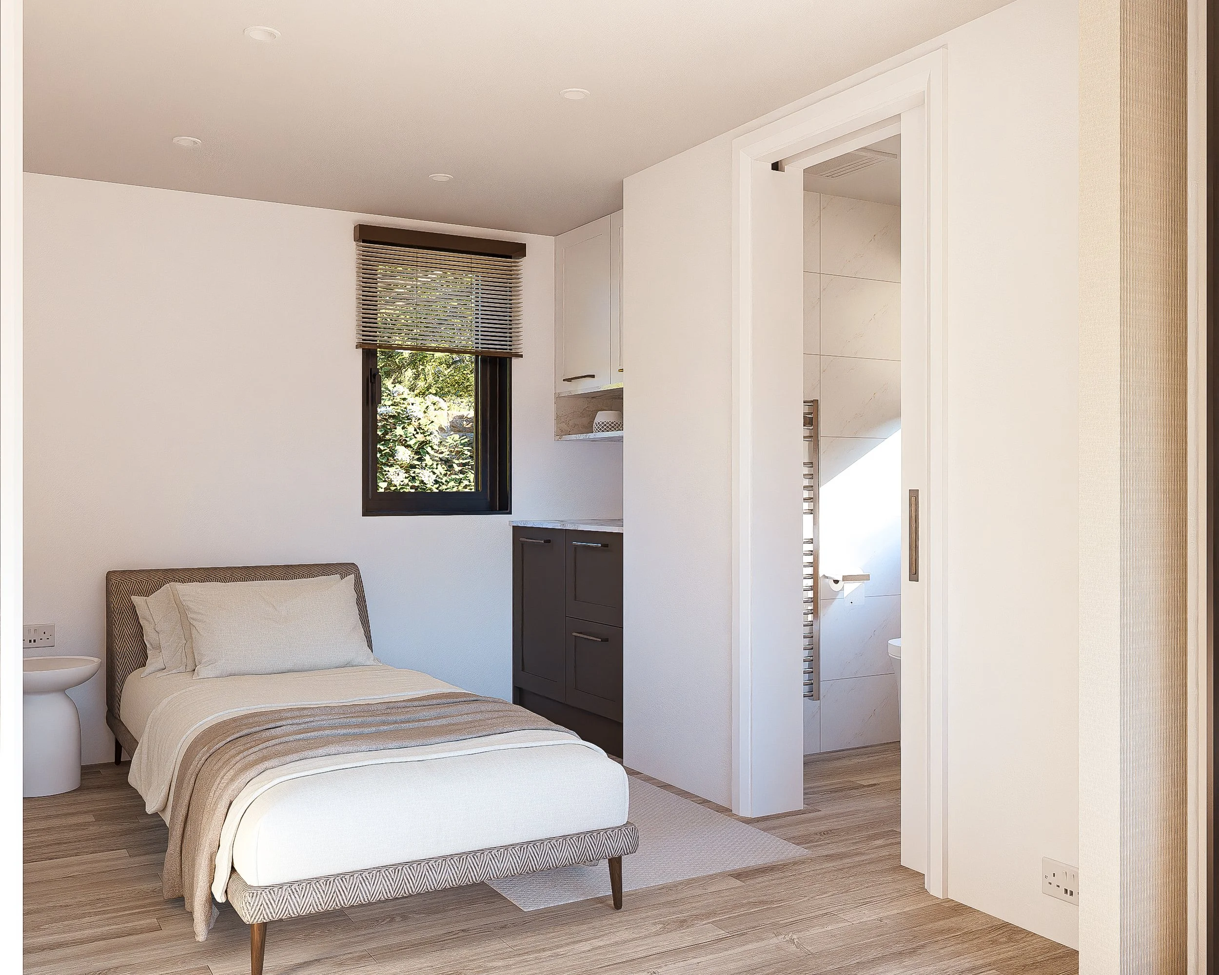 A modern Bauhu hurricane resistant modular hospitality pobedroom with a single bed, gray headboard, white bedding, and beige throw blanket. There is a small white side table beside the bed, a window with blinds showing greenery outside, white wallst.