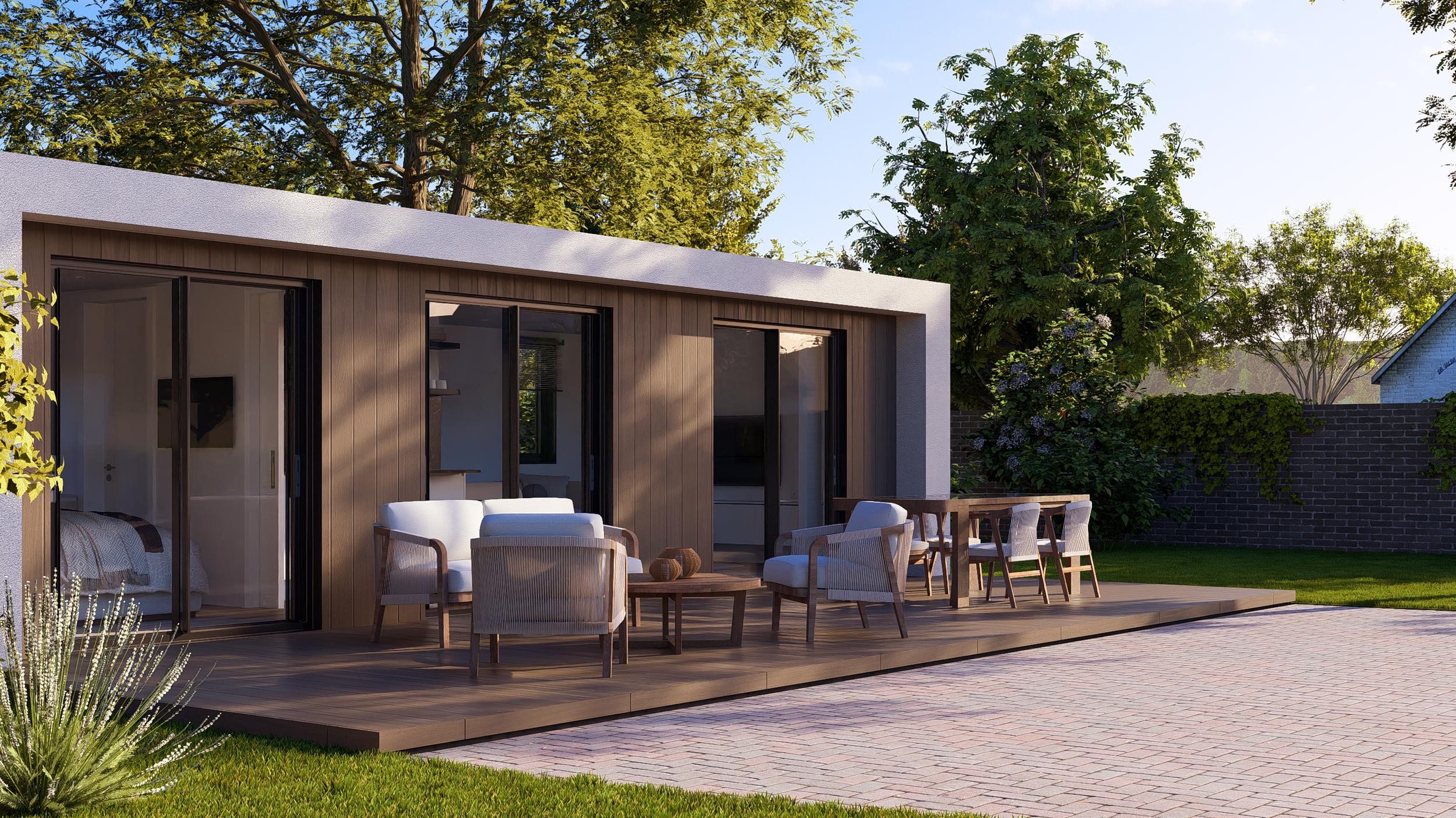 Bauhu hurricane resistant modular hospitality pod Modern house with a wooden patio, outdoor seating, and greenery including trees and shrubs.