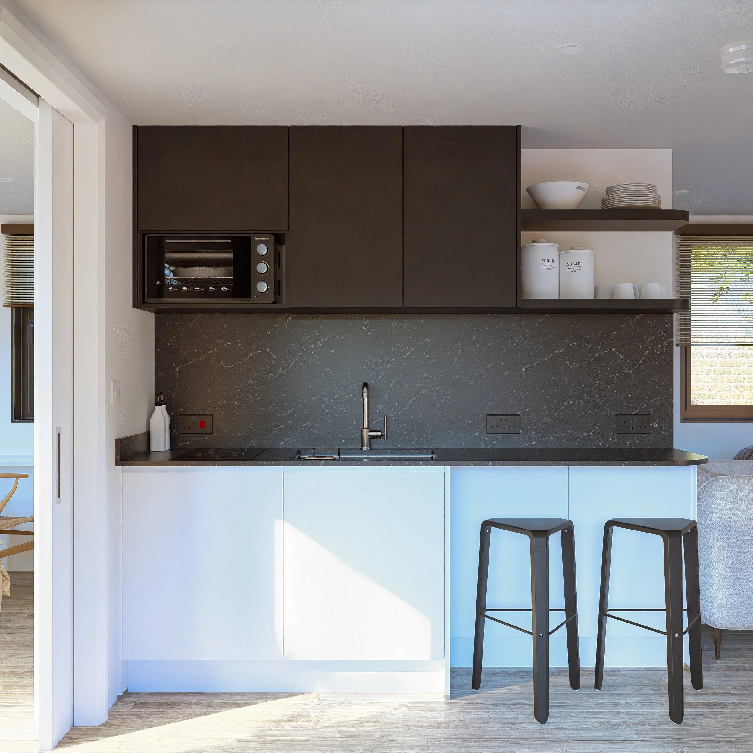 Modern Bauhu hurricane resistant modular hospitality pod kitchen with black upper cabinets, white lower cabinets, black marble backsplash, and two black bar stools in front of the counter.