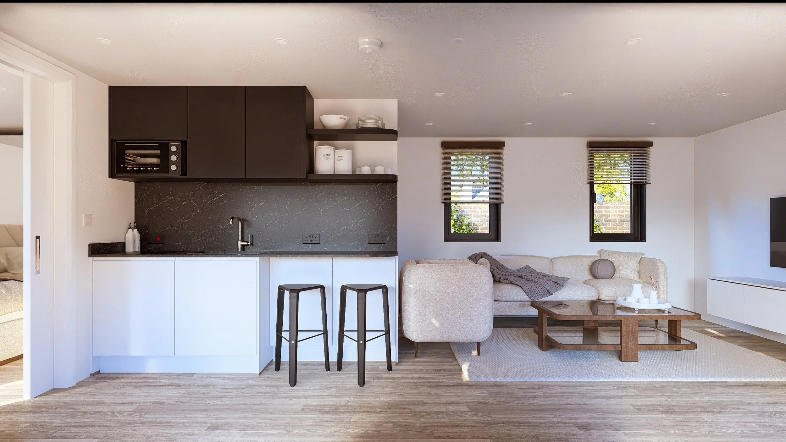 Bauhu hurricane resistant modular hospitality pod Modern open-concept living room and kitchen with natural light, beige sofa, wooden coffee table, black and white cabinetry, two windows with blinds, light wood flooring, and minimal decor.