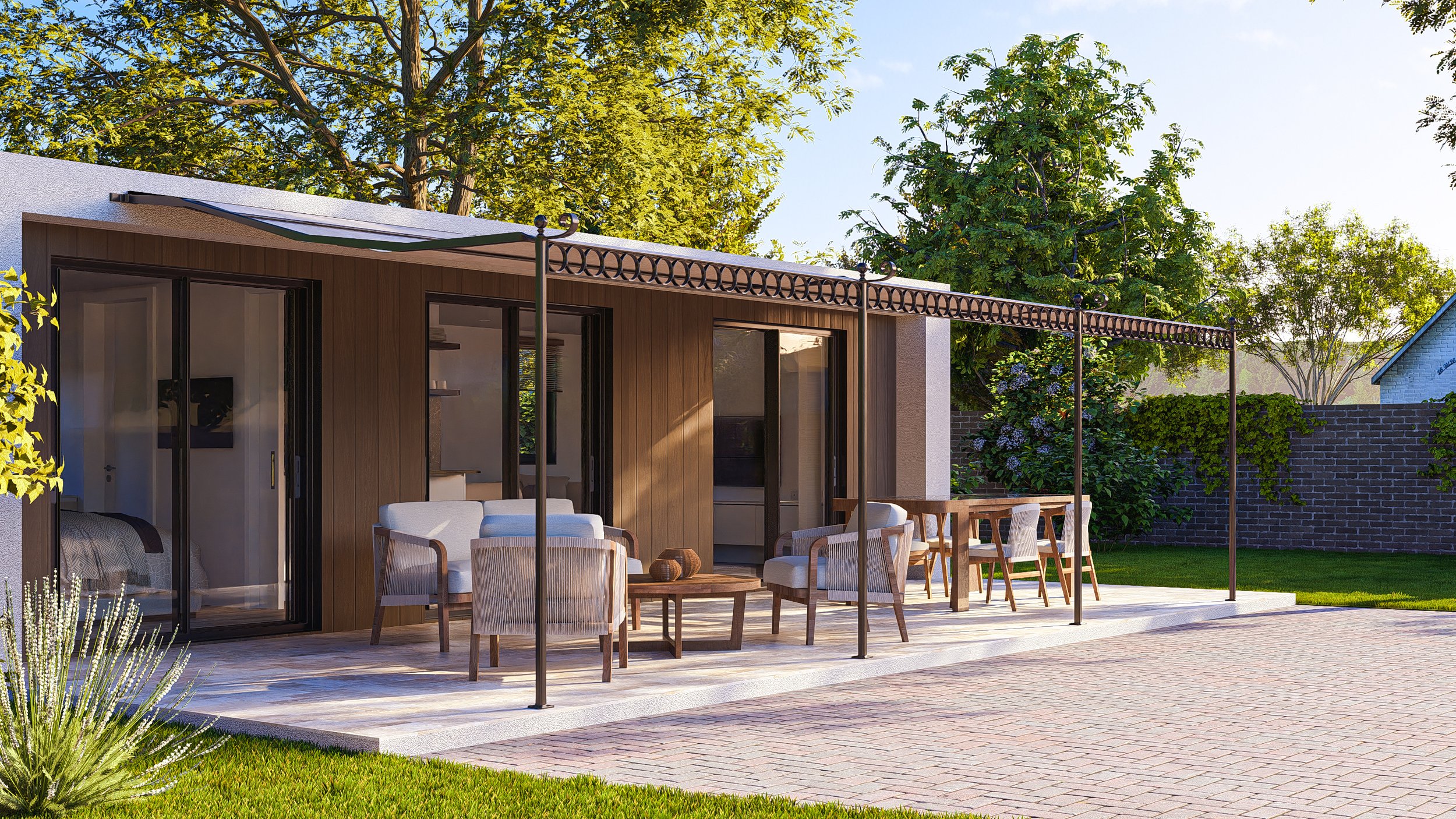 A modern Bauhu hurricane resistanthouse with a large patio featuring outdoor furniture, a wooden dining table, chairs, and a seating area with chairs and a small table. The patio is covered with a retractable awning and surrounded by lush green trees