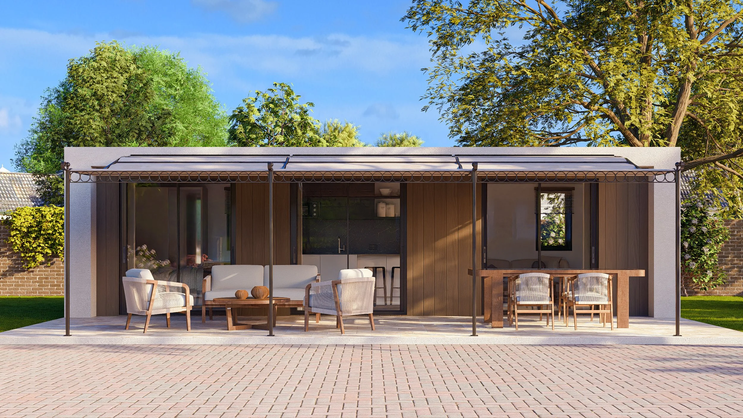 Modern Bauhu hurricane resistant modular hospitality pod patio with furniture, including a sofa, chairs, and a dining table, in front of a house with large sliding glass doors, under a covered pergola, with trees and blue sky in the background.