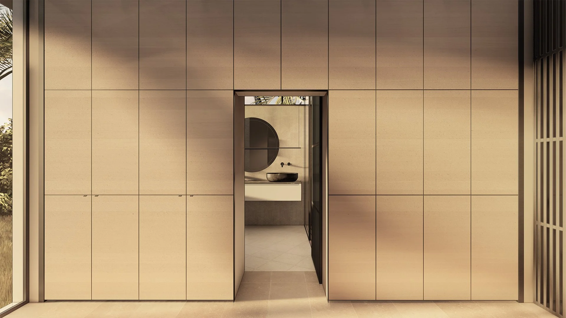Modern modular, hurricane resistant steel frame Bauhu minimalist bathroom with beige tiled wall, black framed mirror, and vessel sink visible through doorway.