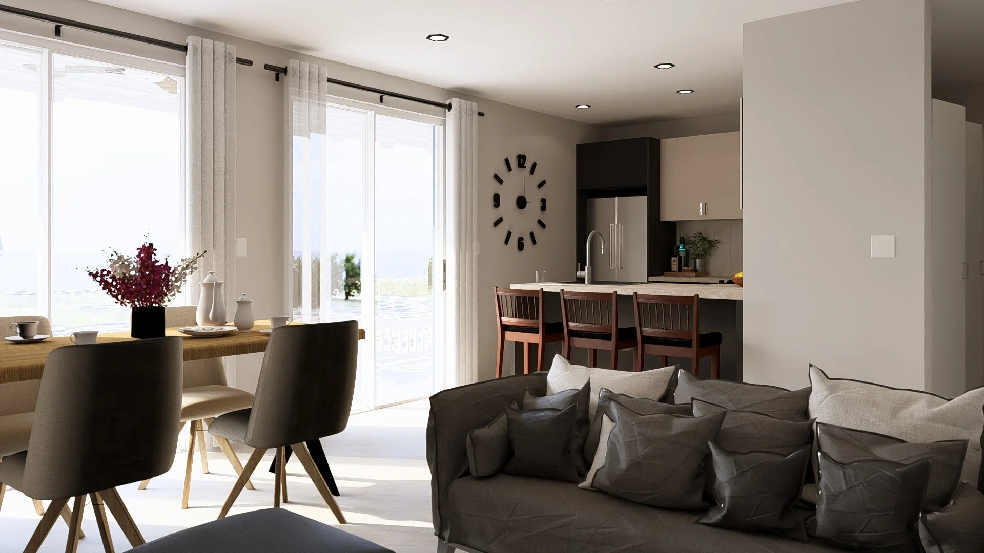modular, hurricane resistant steel frameOpen-concept living and dining area with large sliding glass doors, a wooden dining table with chairs, a gray sofa with multiple pillows, a clock on the wall, and a kitchen with barstools and modern appliances.