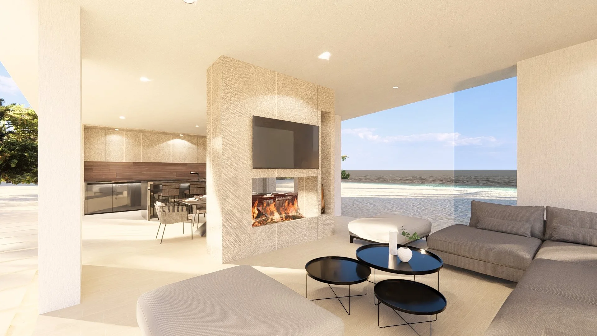 Modern modular, hurricane resistant steel frame Bauhu living room with ocean view, gray sofa, black coffee tables, and a fireplace with a mounted TV, open to a beach and ocean beyond.