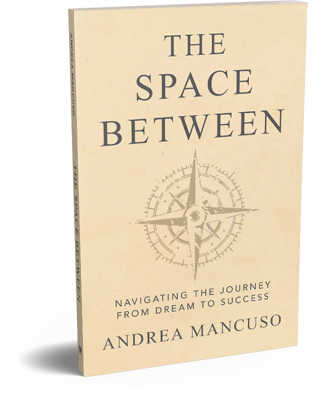 Book titled "The Space Between" by Andrea Mancuso with a compass graphic on the cover.