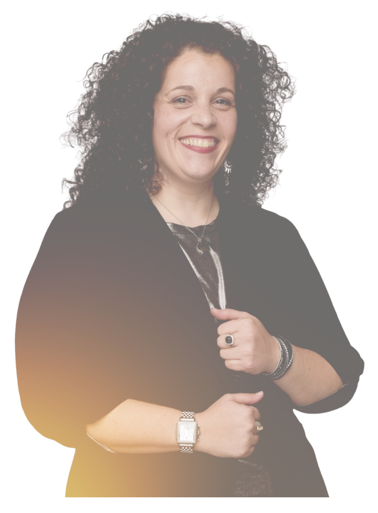 Portrait of a woman with curly dark hair smiling, wearing jewelry and a black outfit.