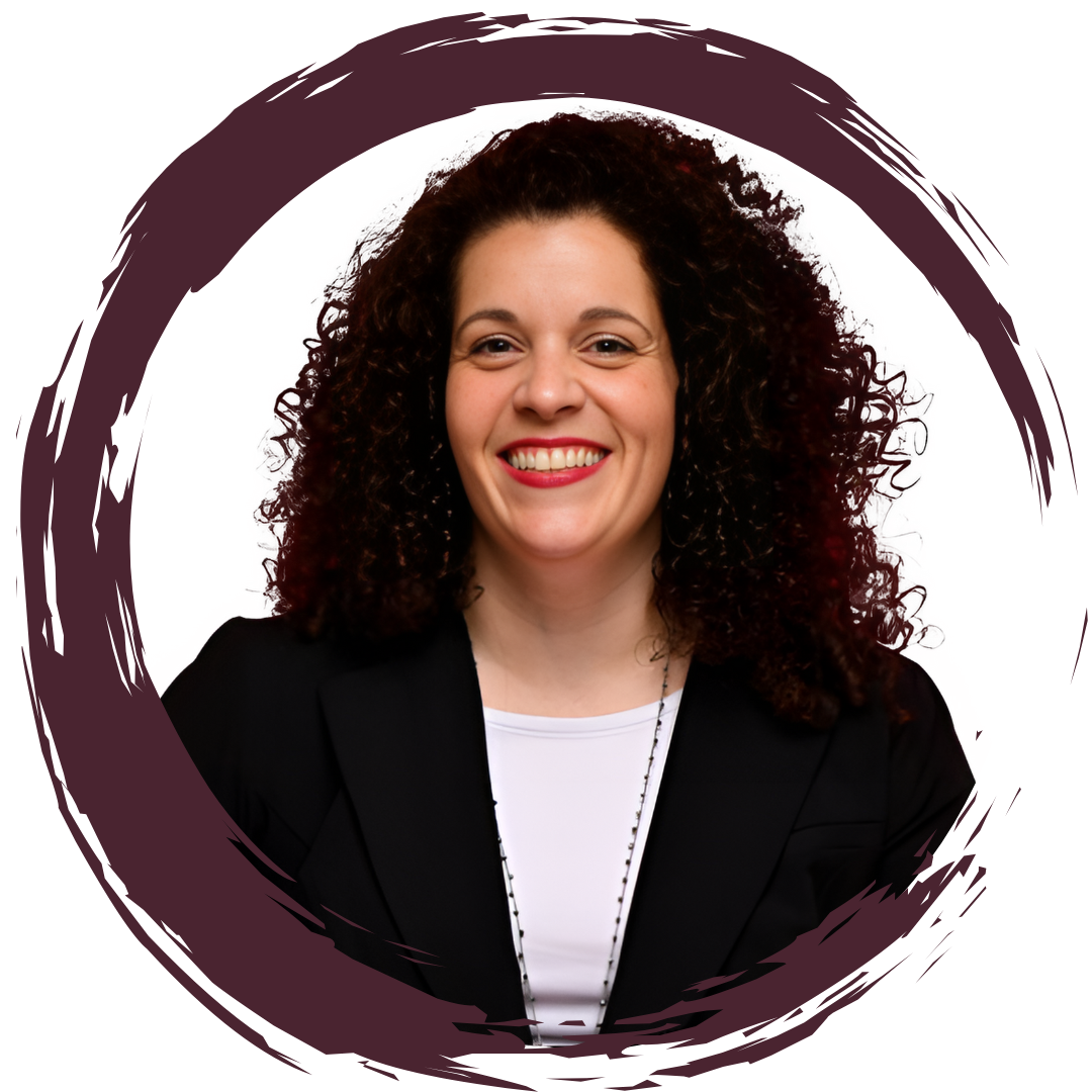 Portrait of a woman with curly dark hair, smiling, wearing a black blazer and white top, with a circular purple brushstroke design around her.