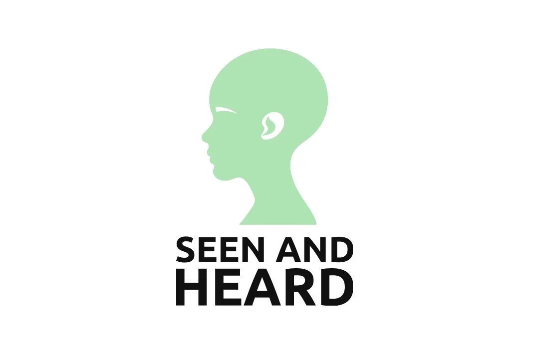 Silhouette of a child's head in green with the text 'Seen and Heard' underneath.