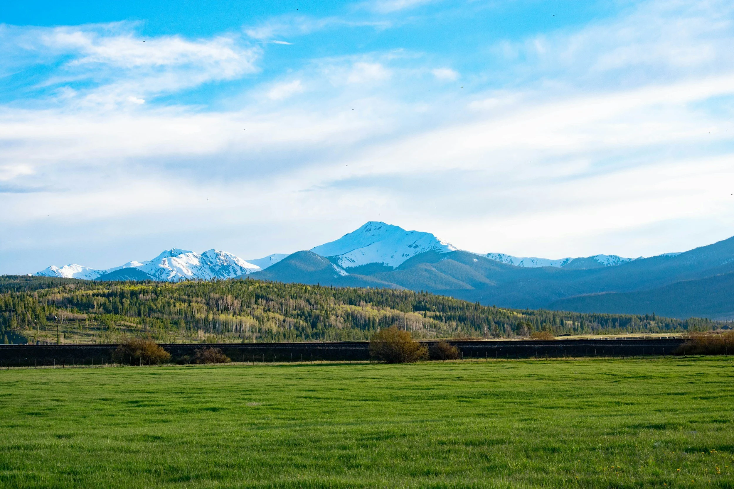 Fraser Valley farmland and mountains, part of the British Columbia regions served by Romano Remote