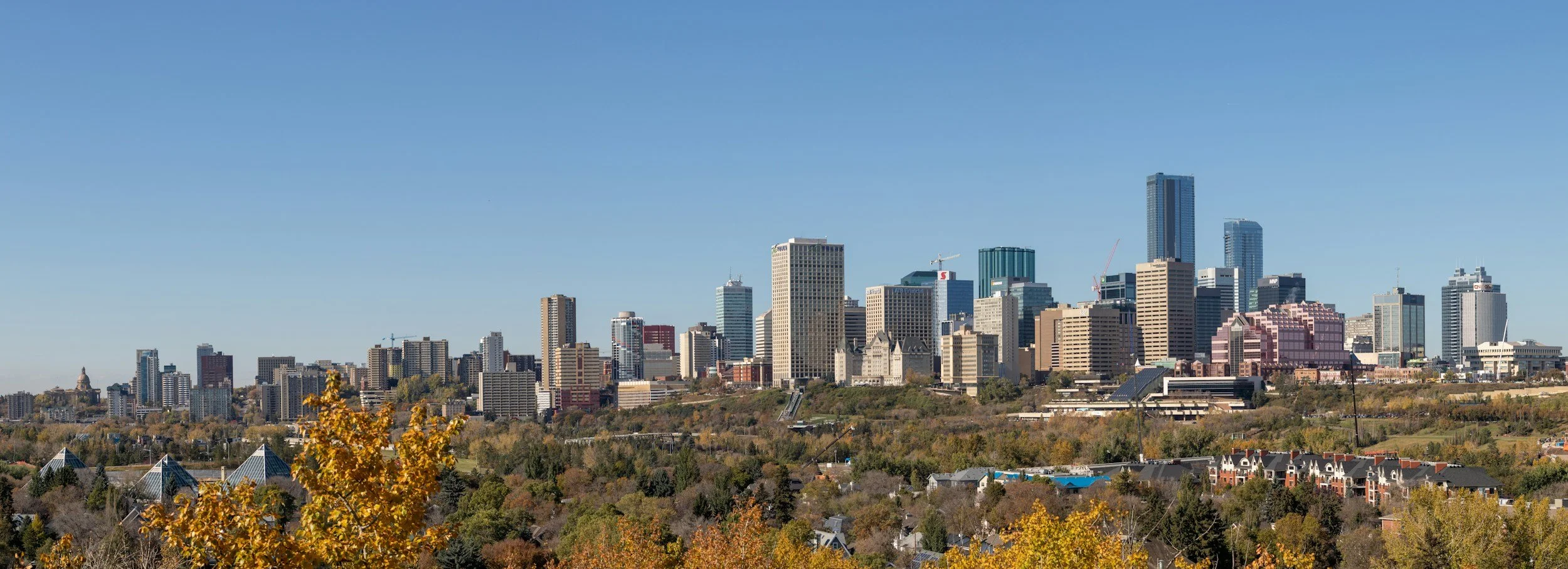 Edmonton skyline over the North Saskatchewan River valley, home to businesses using a virtual assistant in Alberta