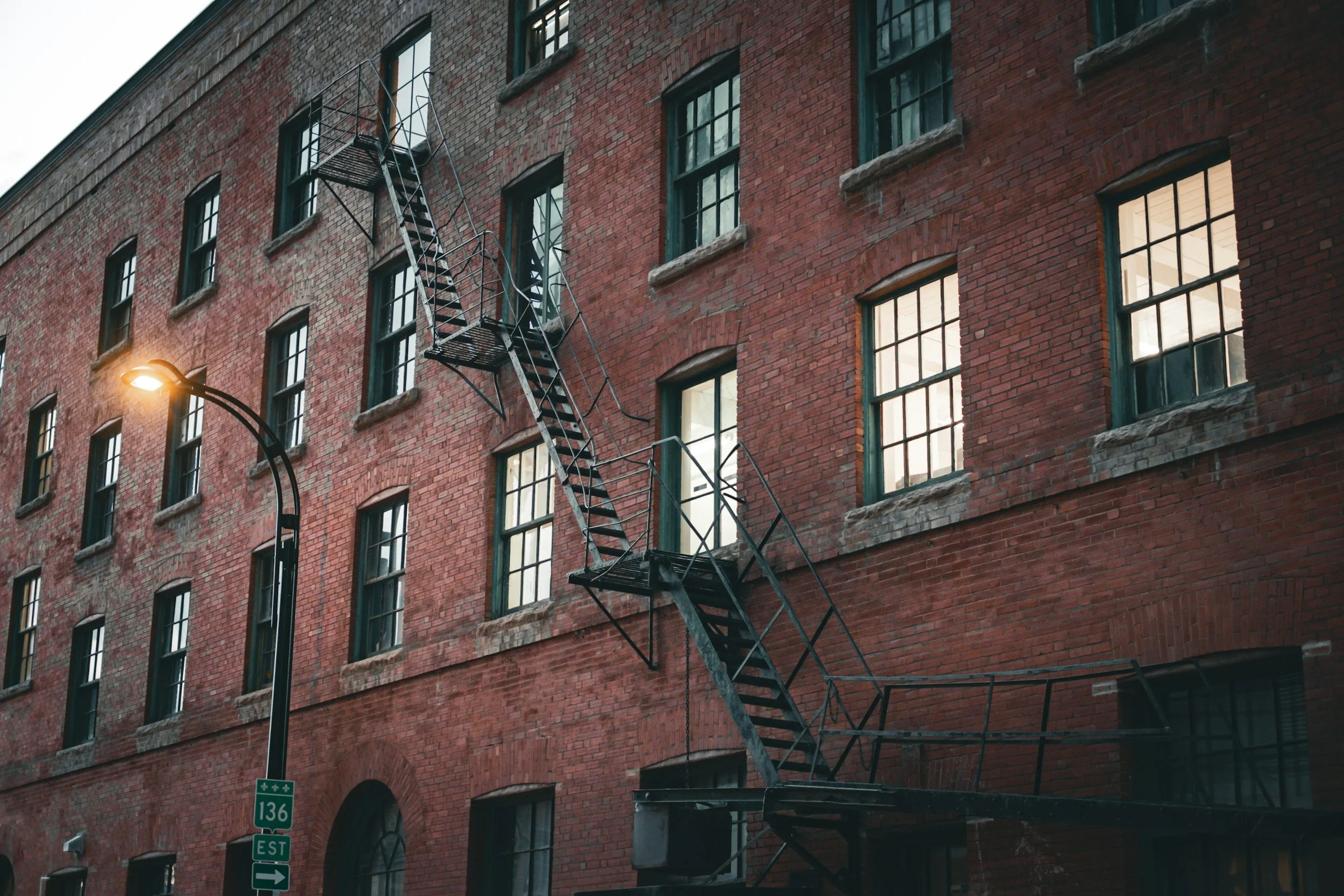 Classic Montréal plex with outdoor staircases, with listing admin handled by a virtual assistant Montreal brokers use
