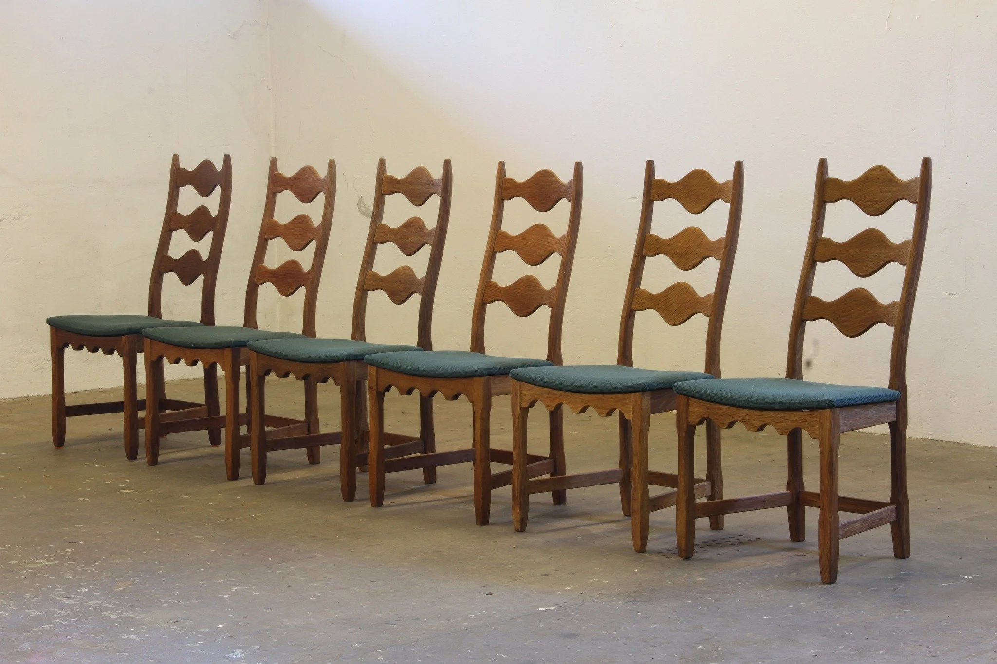 Six Vintage 1960s Danish Ladderback Oak Chairs, Henning Kj&aelig;rnulf Brutalist Style |

SKU: mb00052

Brutalism meets Baroque &mdash; and the result is unforgettable. This set of 6 solid oak ladderback chairs has been professionally cleaned, oiled,