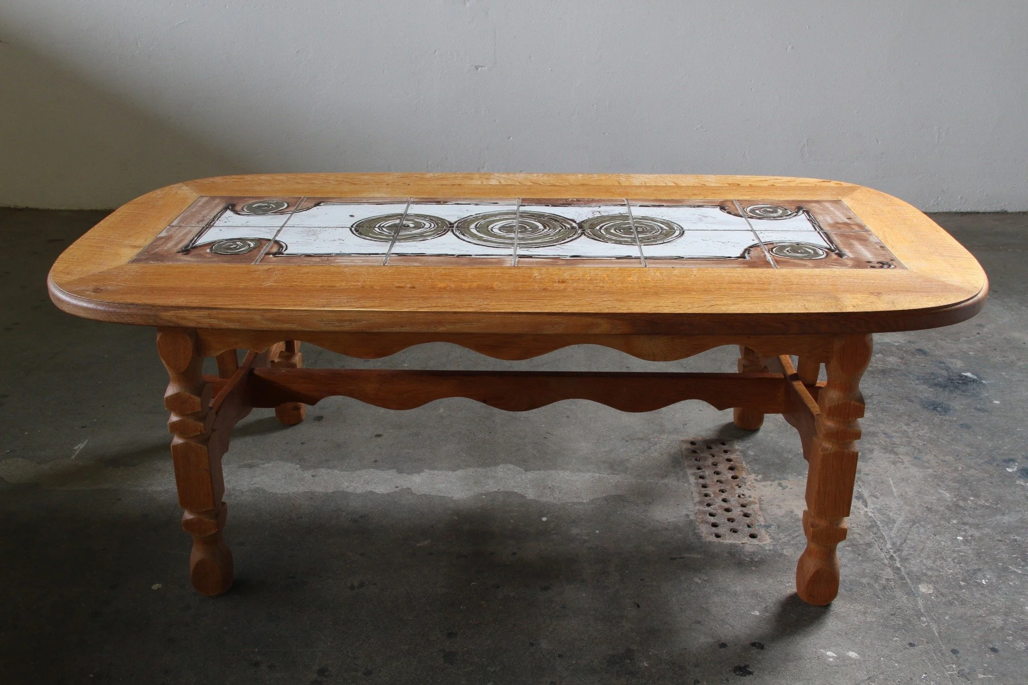 Vintage Danish Brutalist Oak &amp; Tile Coffee Table, style of Henning Kj&aelig;rnulf, 60s 

 SKU: mb00061

Wood meets tile. Warmth meets geometry. This exceptional 1960s Danish coffee table pairs honey-toned solid oak with a stunning decorative cera