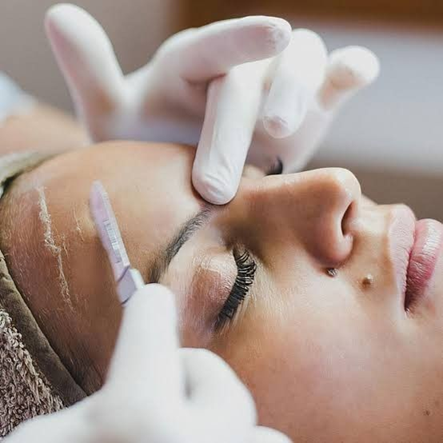 woman getting dermaplaning service done