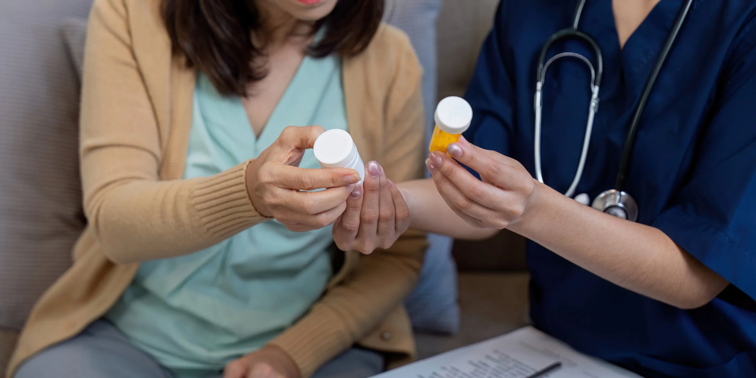 A patient and medical professional discuss medicine together