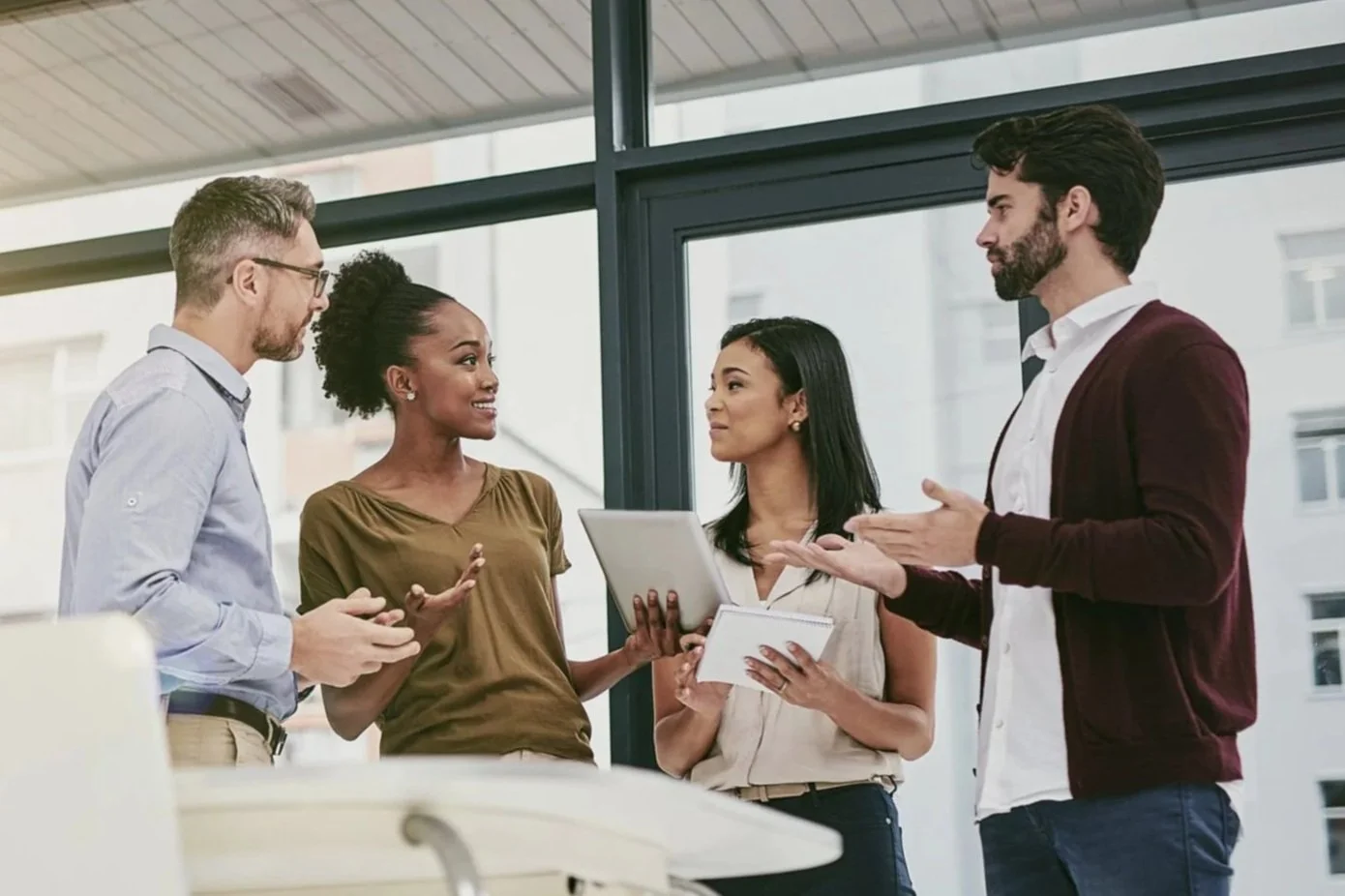 Therapists in an office with notes discussing business building strategies.