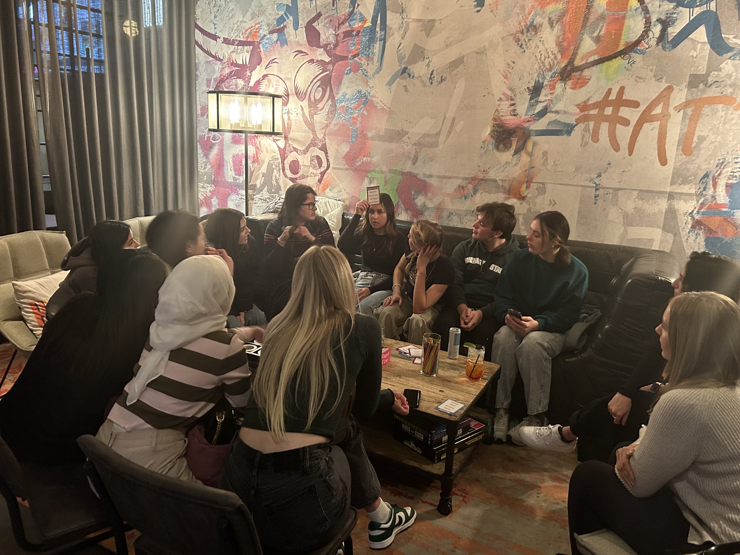Our members playing games during our Chicago social at Zombie Taco!