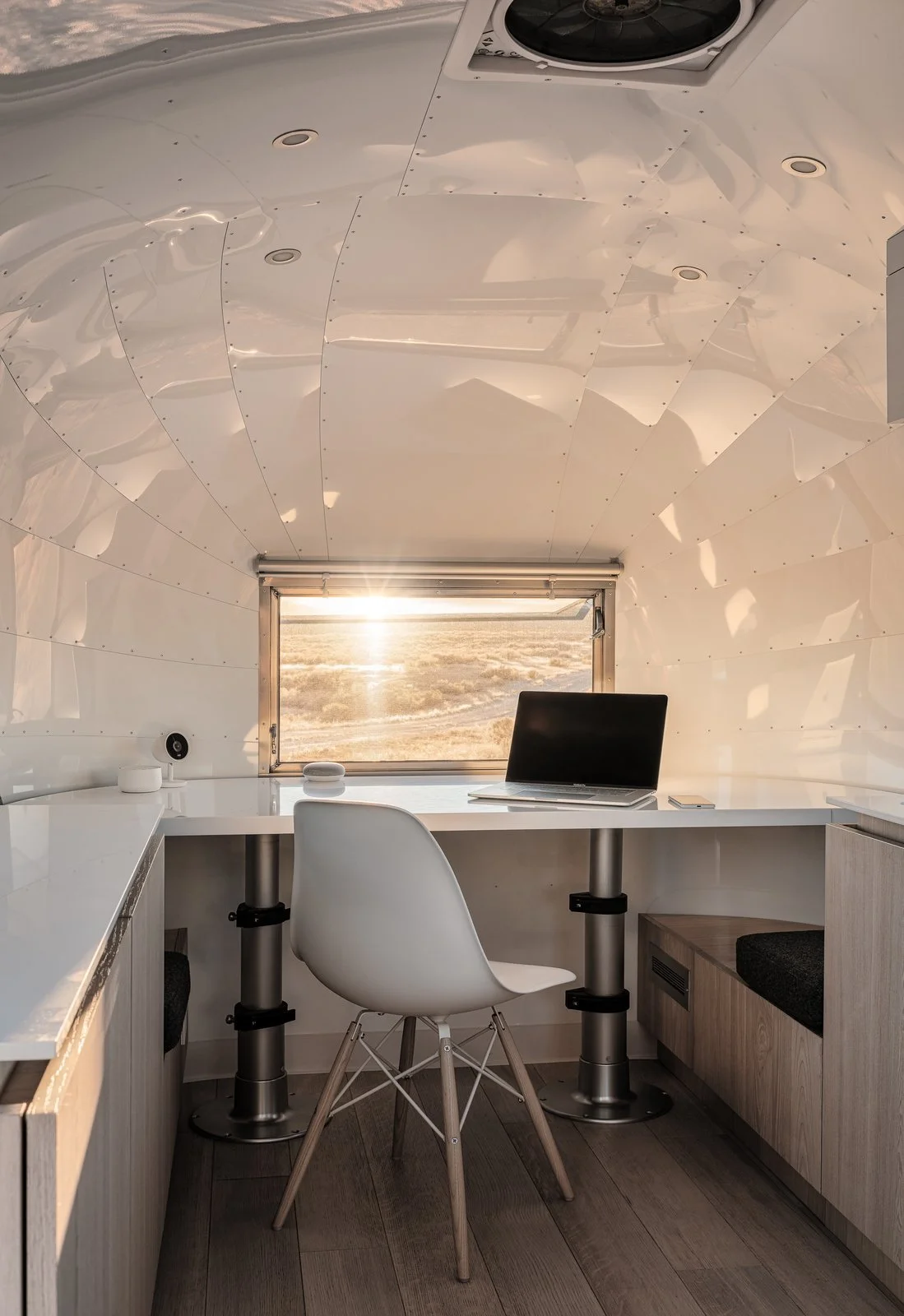 at-just-80-square-feet-the-kugelschiff-is-a-renovated-airstream-bambi-ii-that-now-serves-as-a-tech-entrepreneurs-tiny-home-and-office-edmonds-lee-architects-designed-a-desk-set-on-pisto.jpg