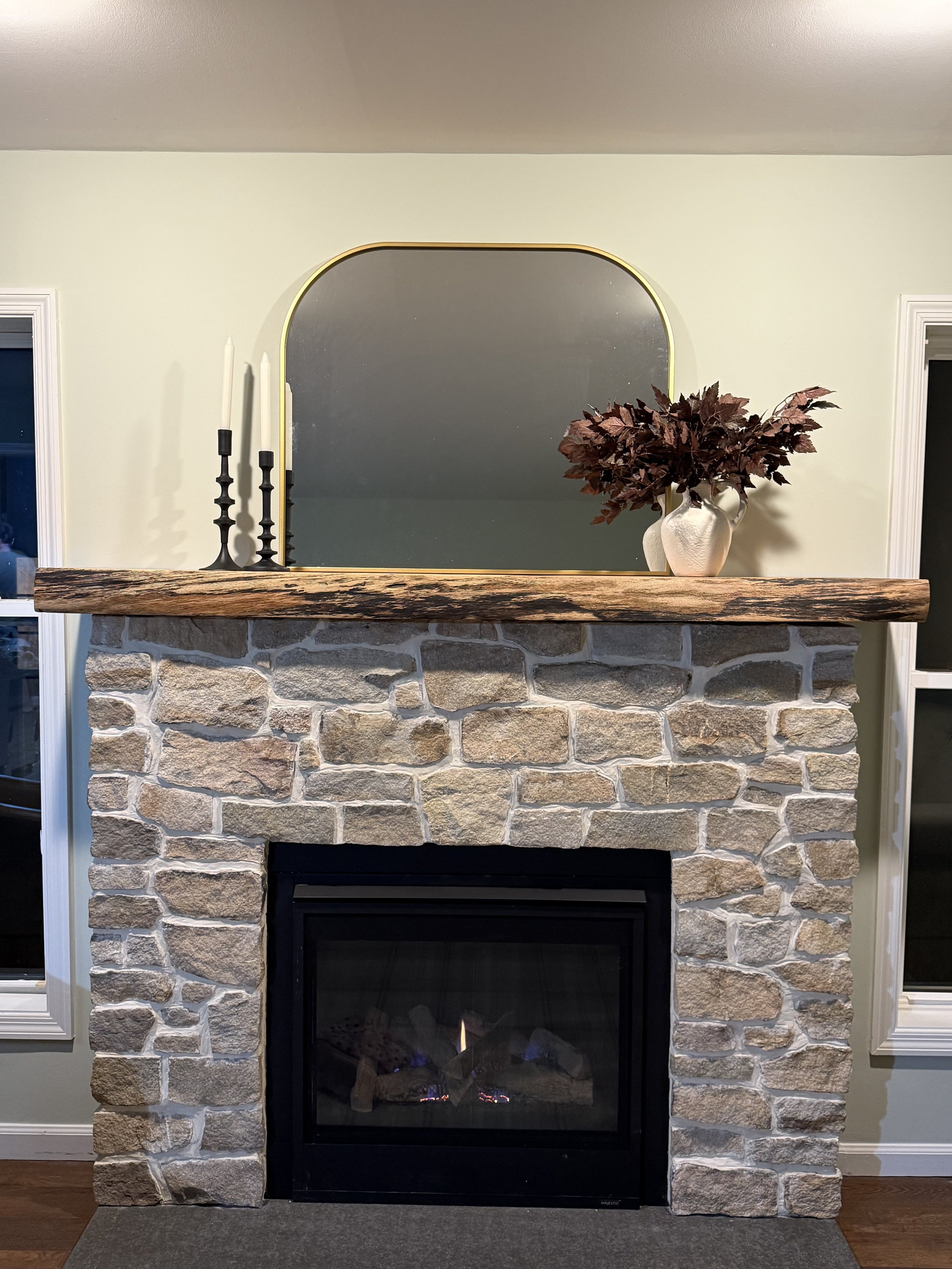 A Dream fireplace, finally built: natural stone surround with reclaimed wood mantel