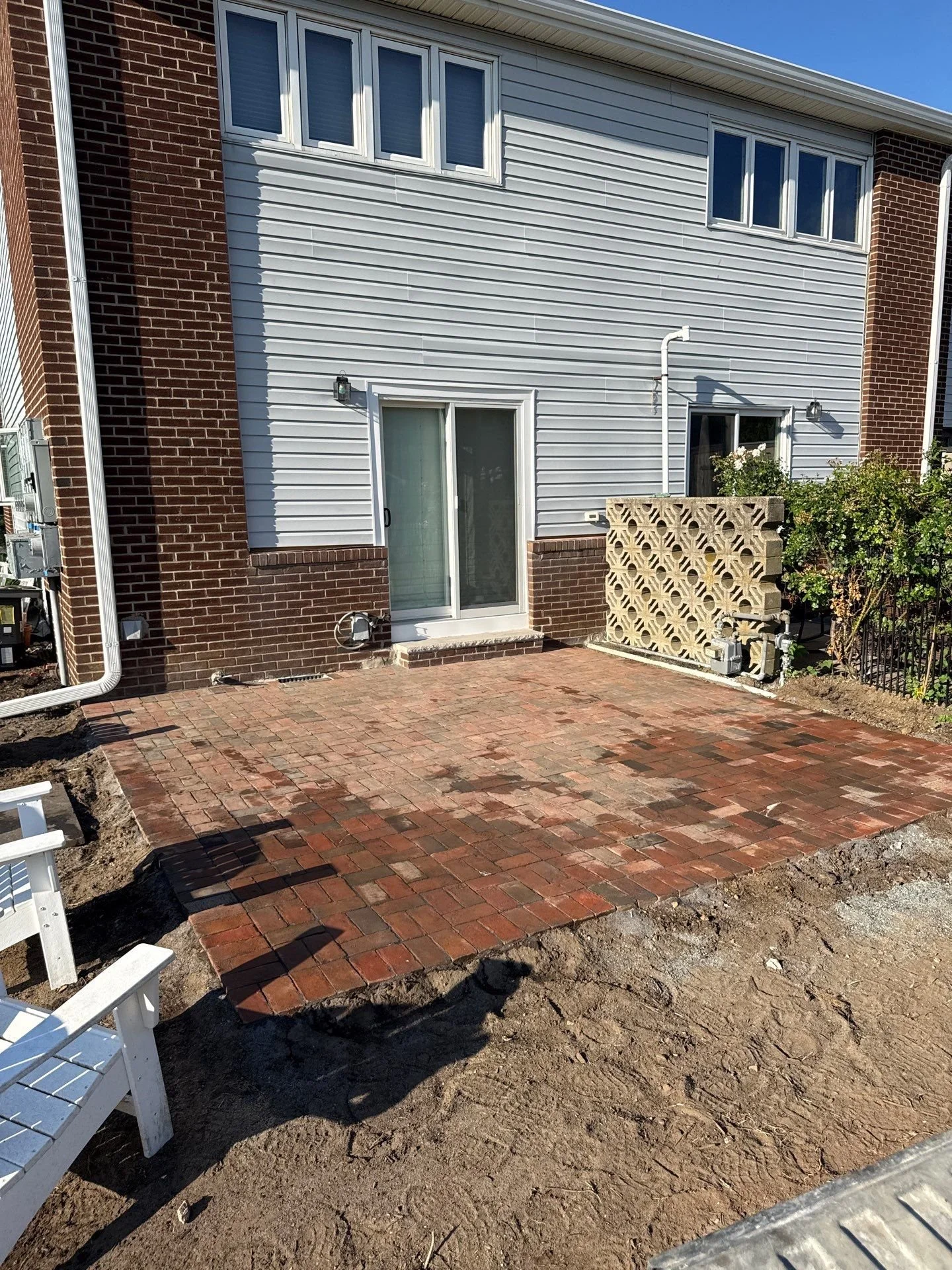 brick paver patio creates a beautiful outdoor living space