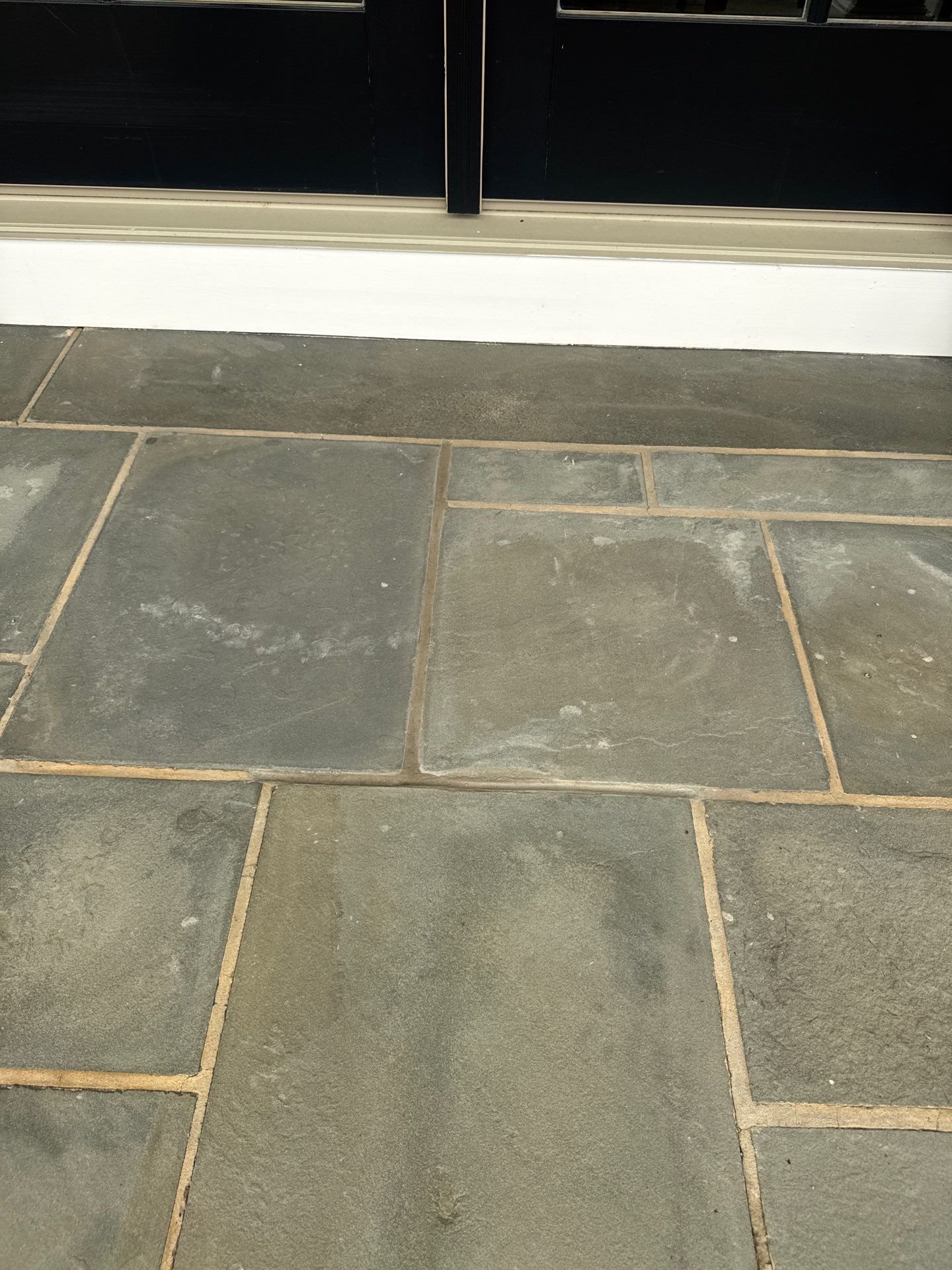 Bluestone patio repointing restores a front entry
