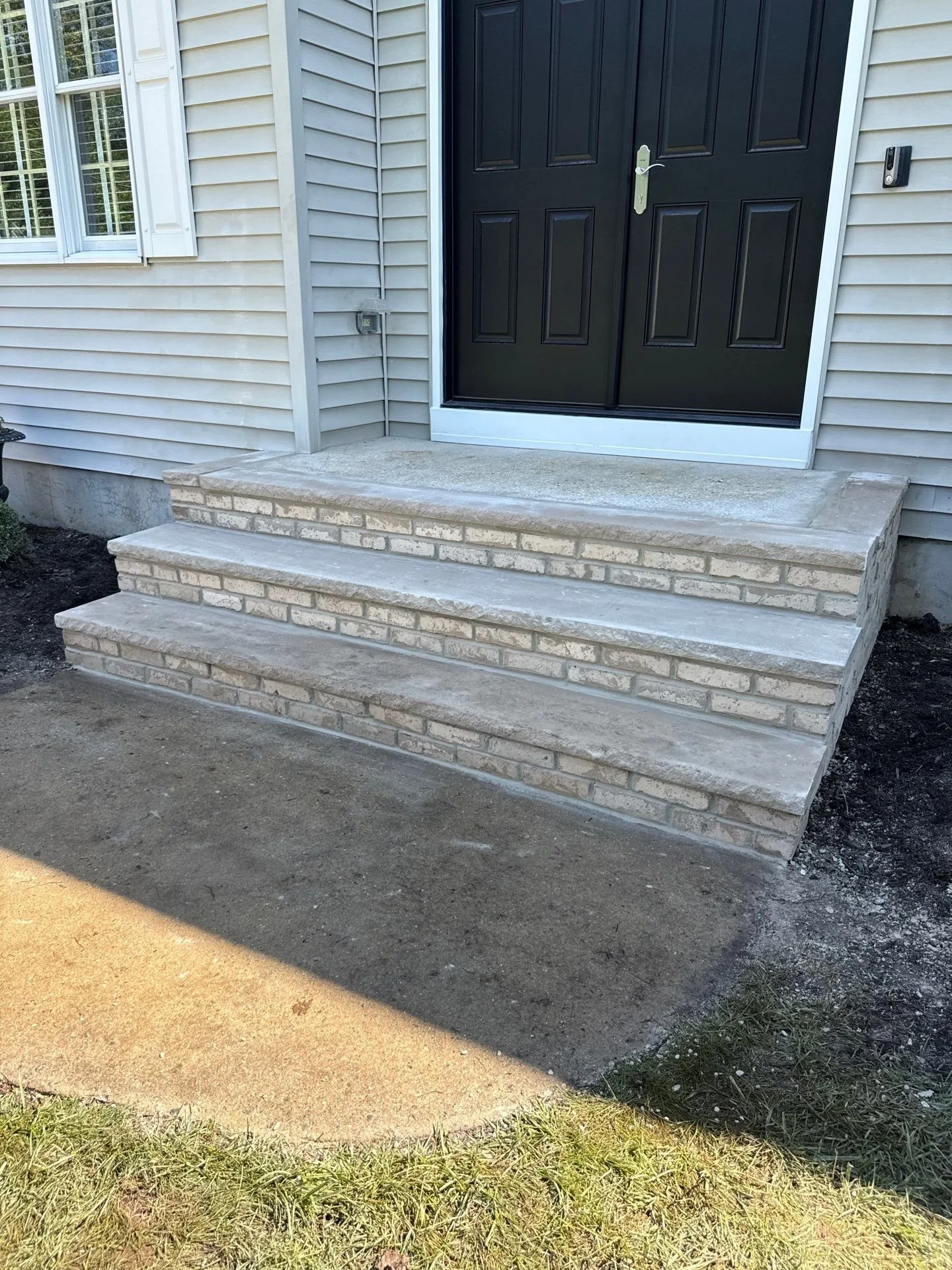front entry steps get a brick veneer rebuild
