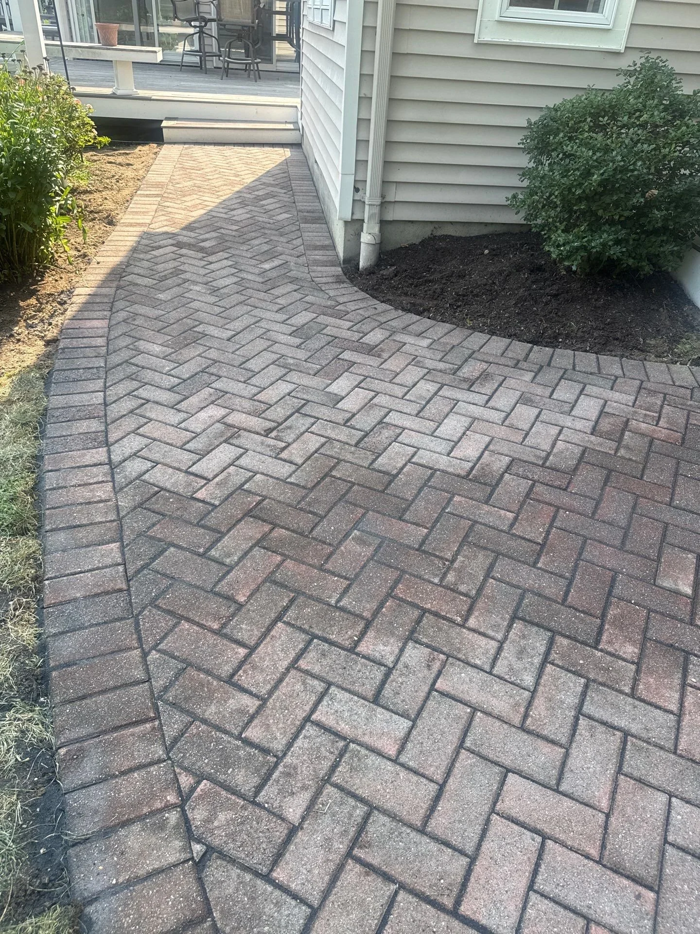 paver walkway releveling brings a side yard path back to life