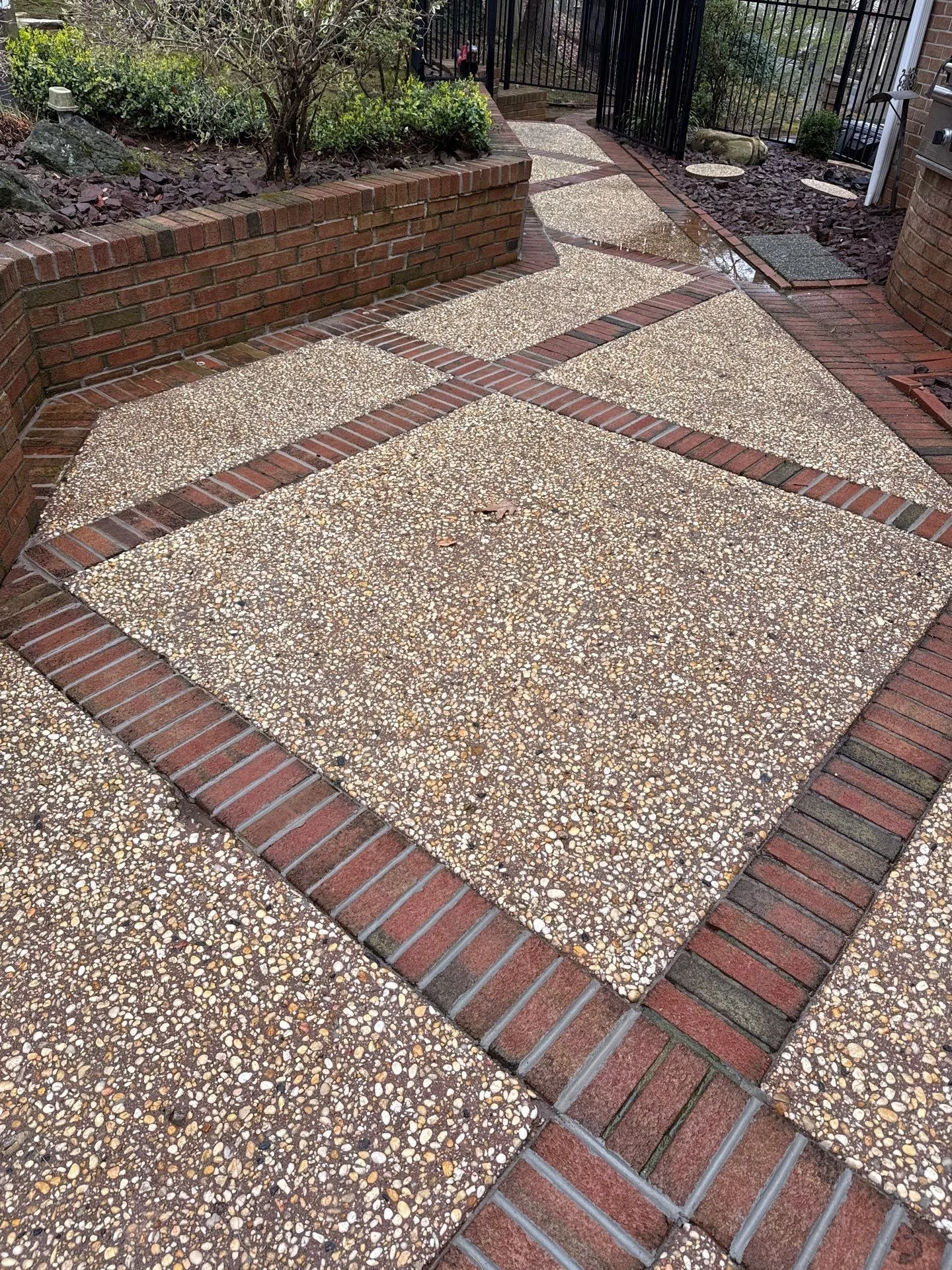 Concrete and brick patio restoration in Monmouth County NJ featuring repaired masonry joints, cleaned surfaces, and restored outdoor hardscaping.