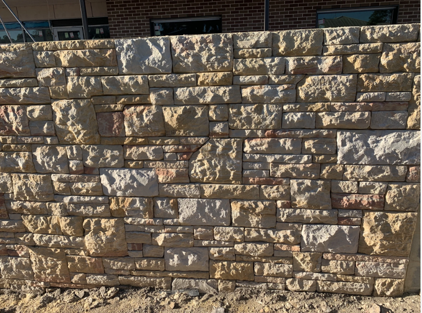 Stone wall with irregular rectangular blocks