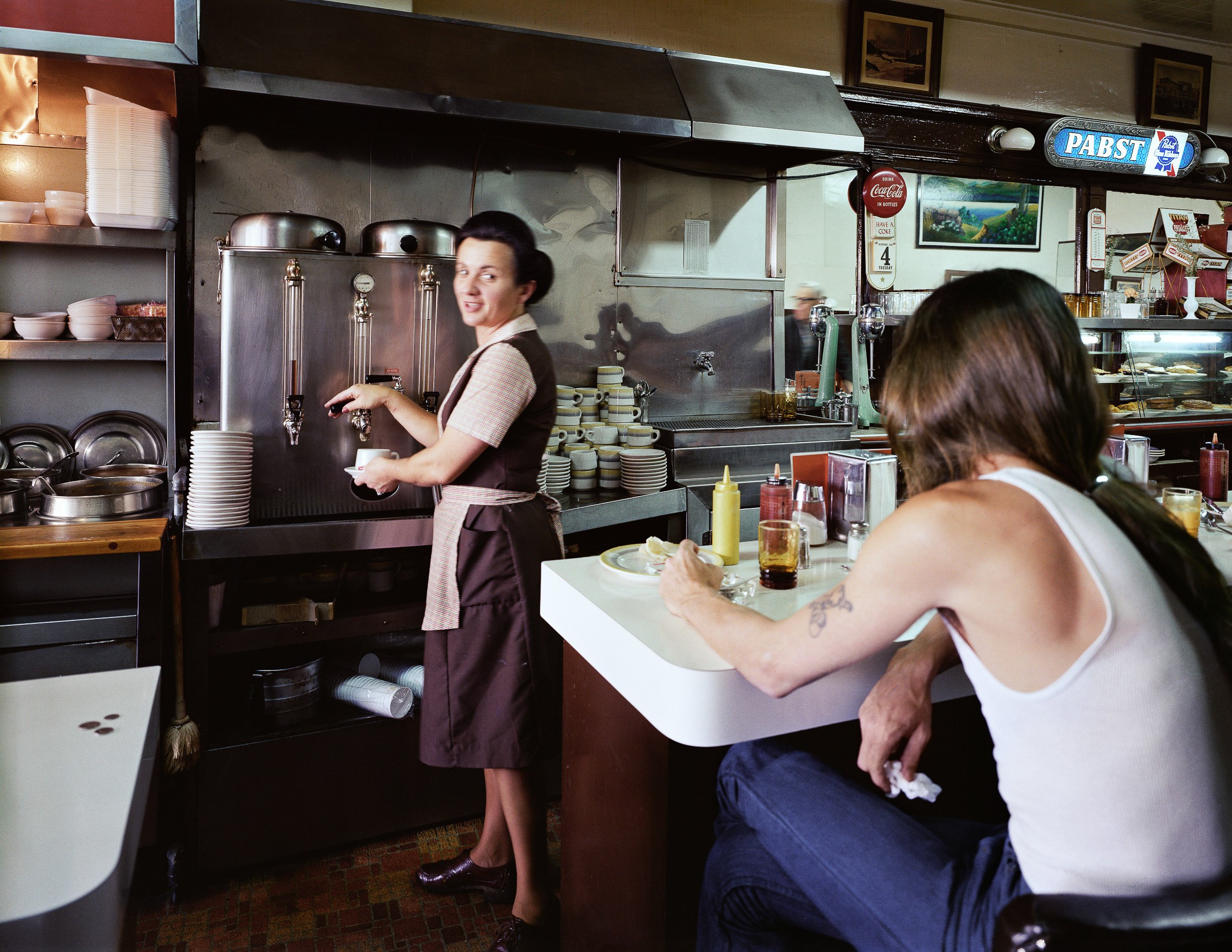   Pat Serving Coffee at the Gordon Cafe, 7th at Mission Street, 1980  