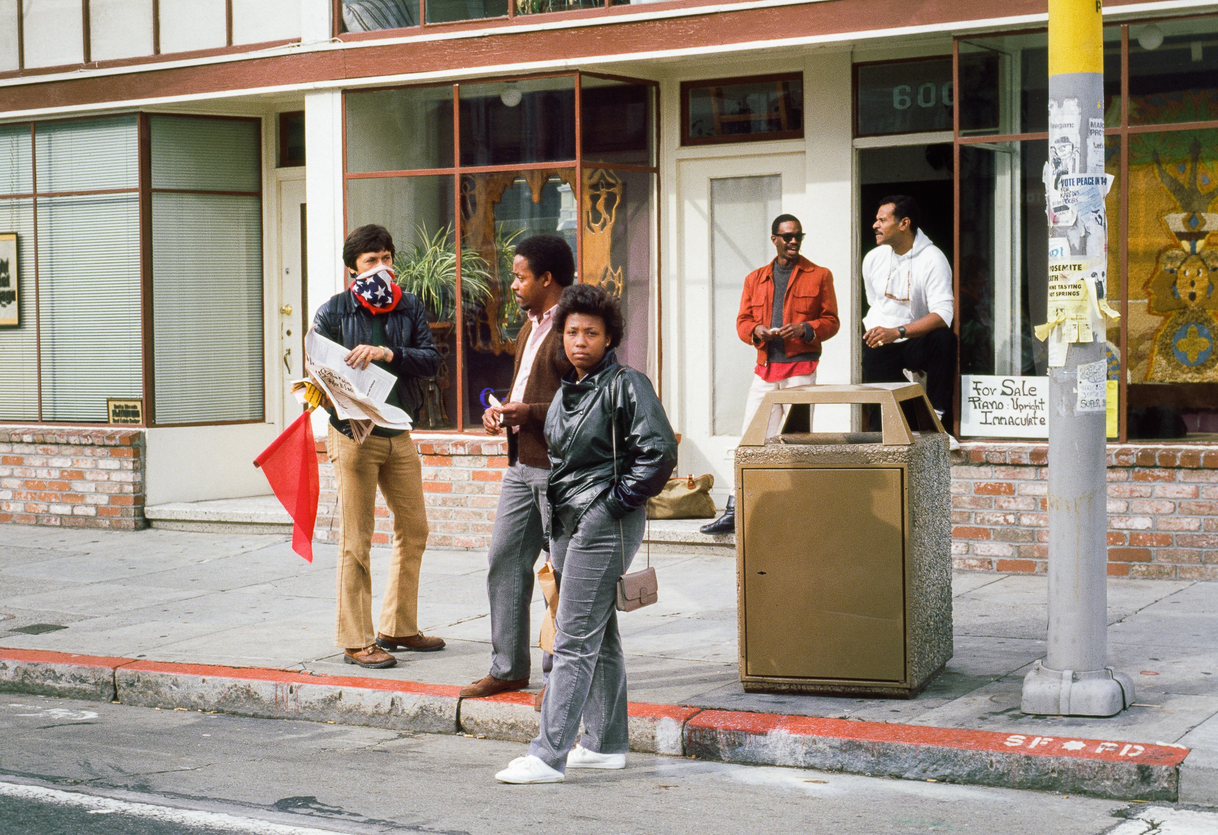   Masked Man Selling Newspaper, 24th St, 1984  