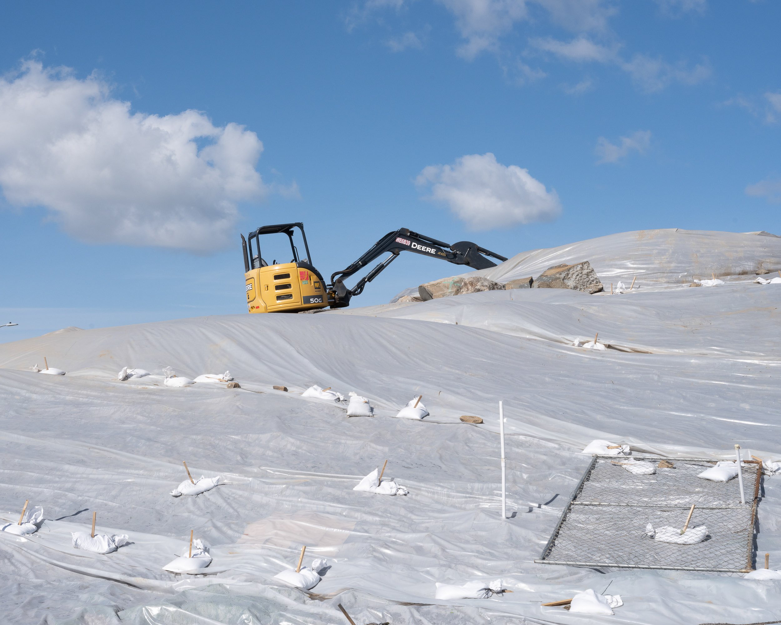   Construction Equipment on Hill Covered in Plastic, 2023  