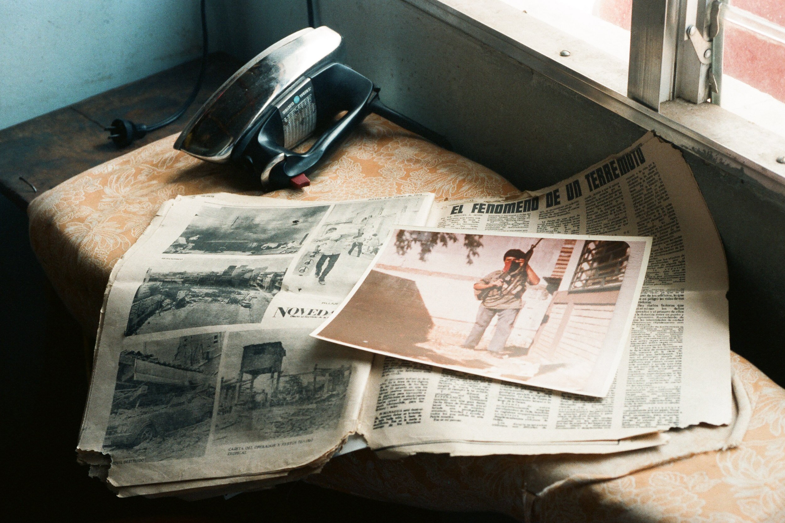 Photo of Son, Luis Felipe, in Front of a Safe House Lays on Newspaper  from 1972 Earthquake_Foto del Hijo, Luis Felipe, Frente a una Casa de Sequirdad con Reconrtes del Terremoto de 1972.jpg