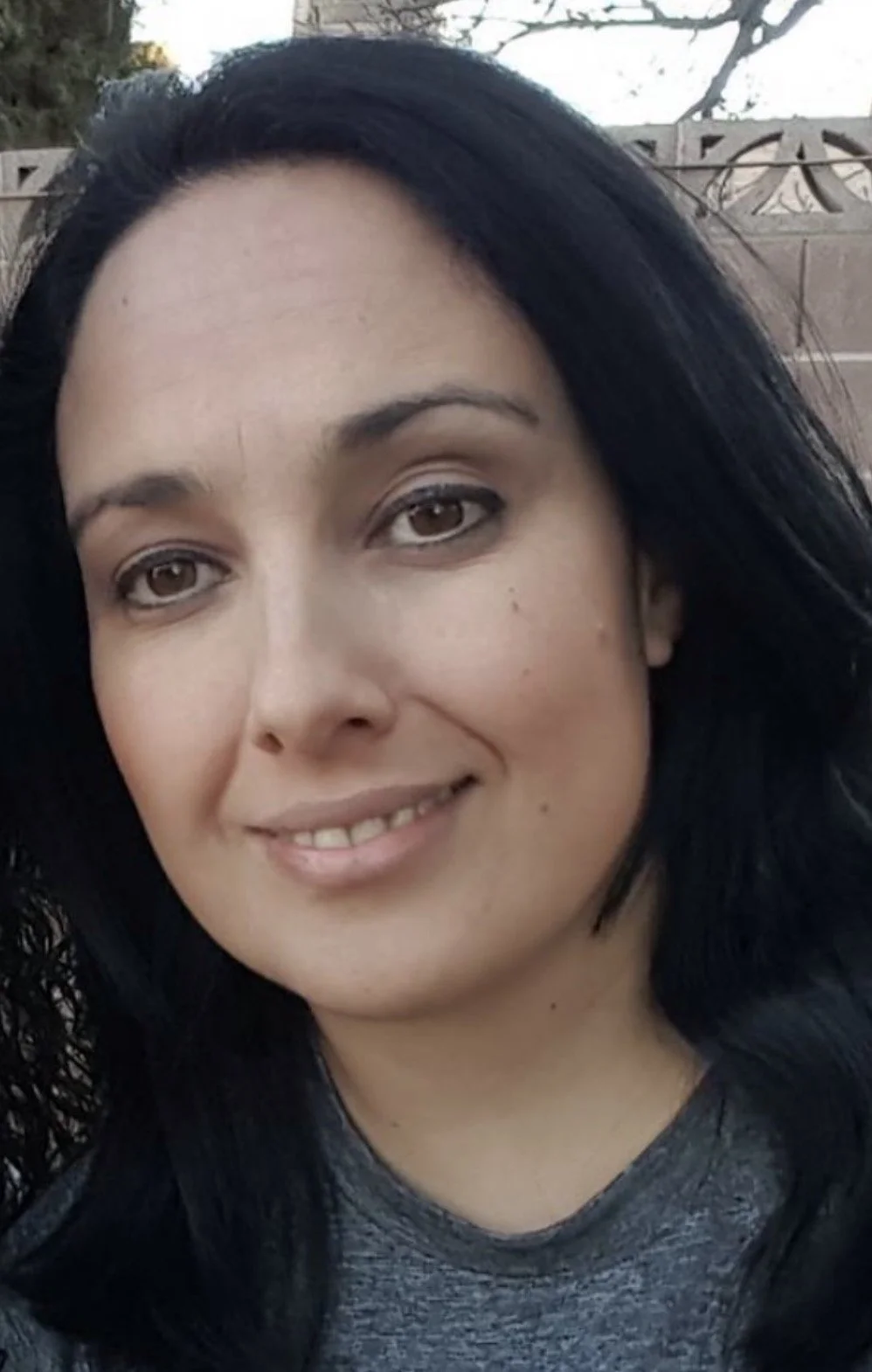 An image of Nely Sanchez smiling.