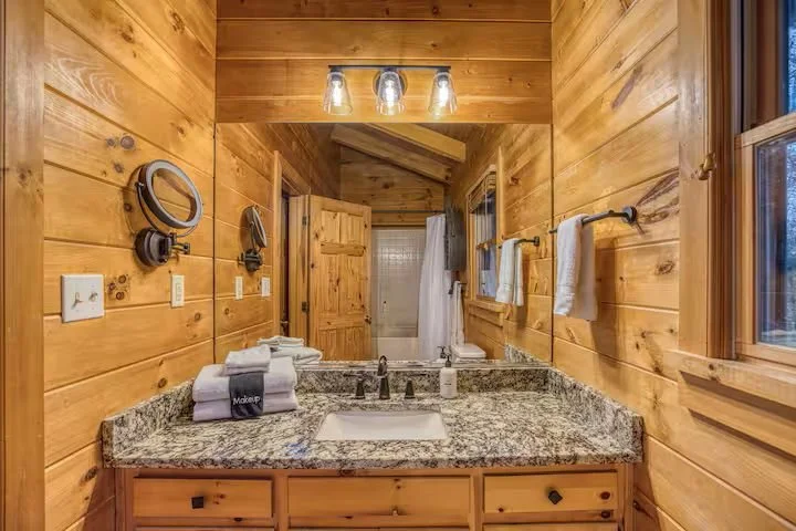 The upstairs Master Bathroom is a private ensuite with a refreshed four-piece layout has a bathtub/shower combo and updated fixtures. Essential toiletries and plenty of fresh towels make this clean, comfortable space perfect for everyday convenience.