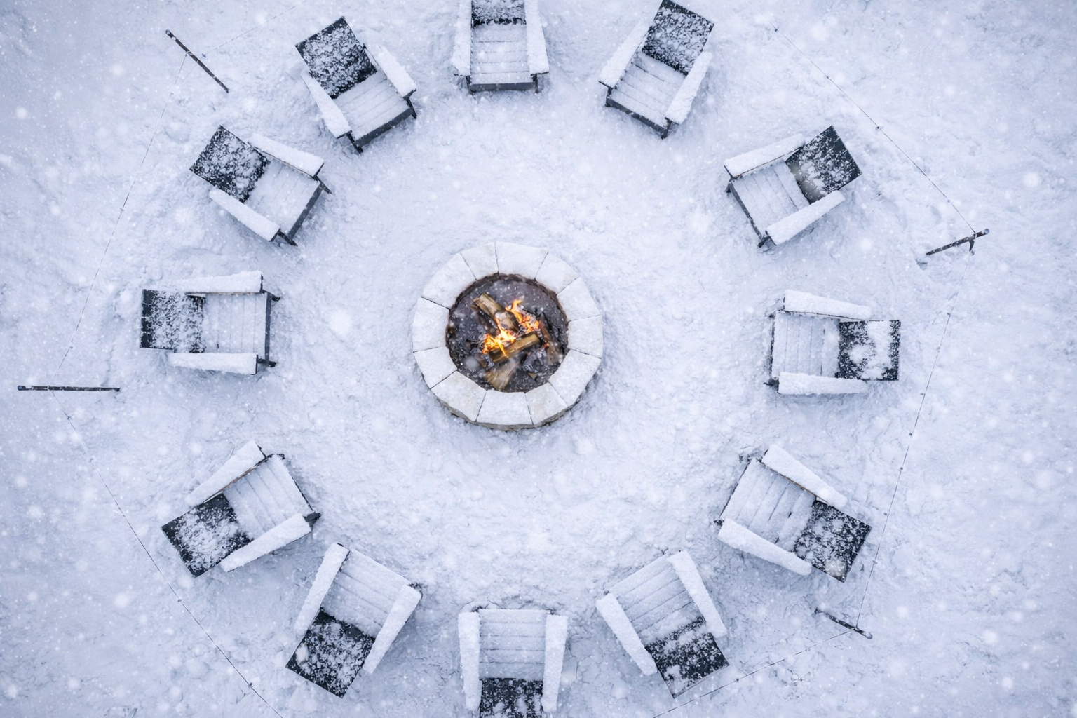 Relax and enjoy a large cozy outdoor firepit surrounded by Adirondack chairs, glowing stonework, and crackling flames with string lights overhead. Open up a bottle of wine, roast some marshmallows, and make some s’mores in the evening under the stars