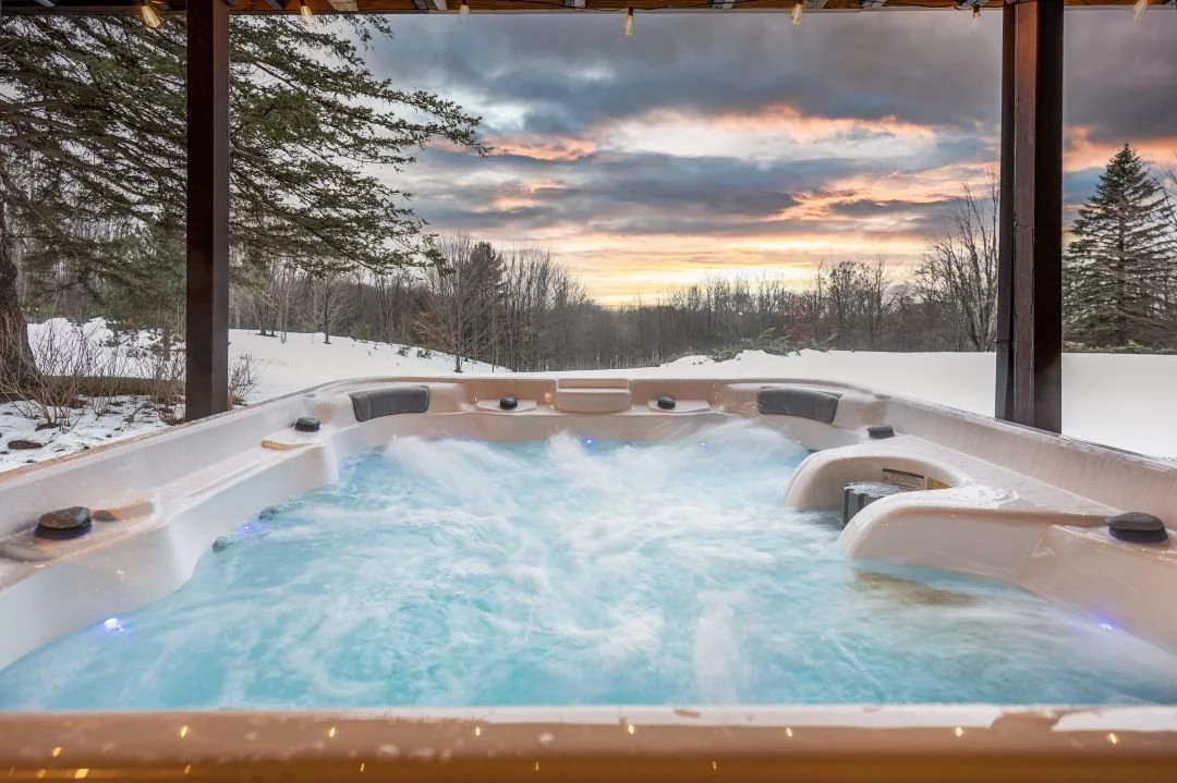 The private 7-person jacuzzi, located under the back deck, features dual jets and ambient lighting. After a long day of golfing, hiking or skiing, you can relax with a glass of wine and enjoy a stunning sunset over northern Michigan’s natural beauty.