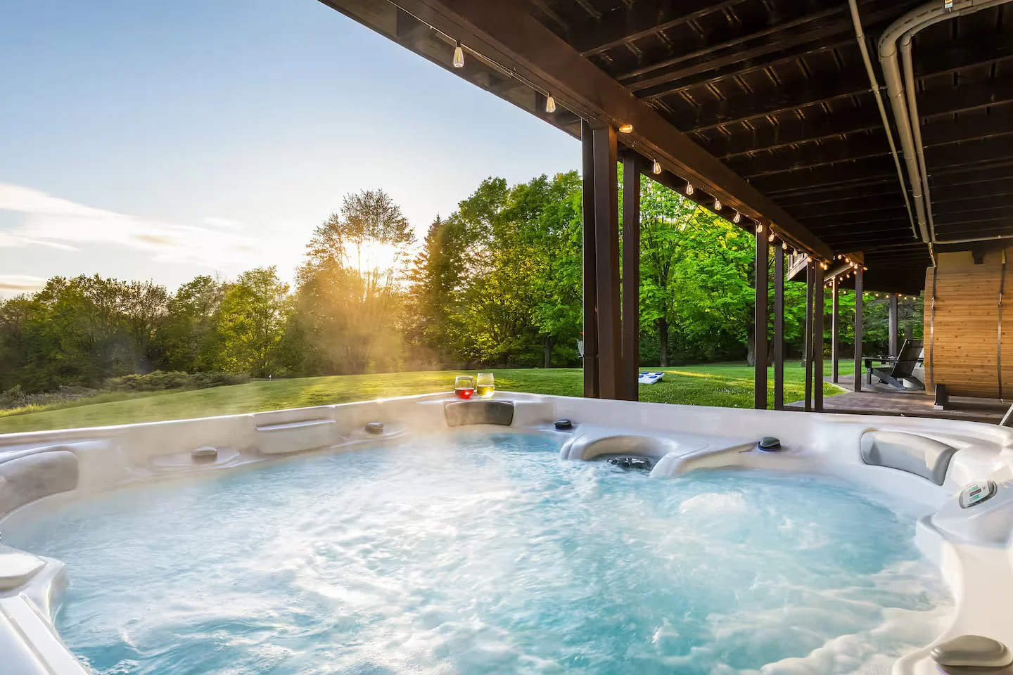 The private 7-person jacuzzi, located under the back deck, features dual jets and ambient lighting. After a long day of golfing, hiking or skiing, you can relax with a glass of wine and enjoy a stunning sunset over northern Michigan’s natural beauty.