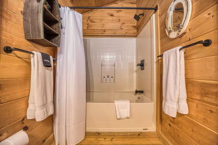 The upstairs Master Bathroom is a private ensuite with a refreshed four-piece layout has a bathtub/shower combo and updated fixtures. Essential toiletries and plenty of fresh towels make this clean, comfortable space perfect for everyday convenience.