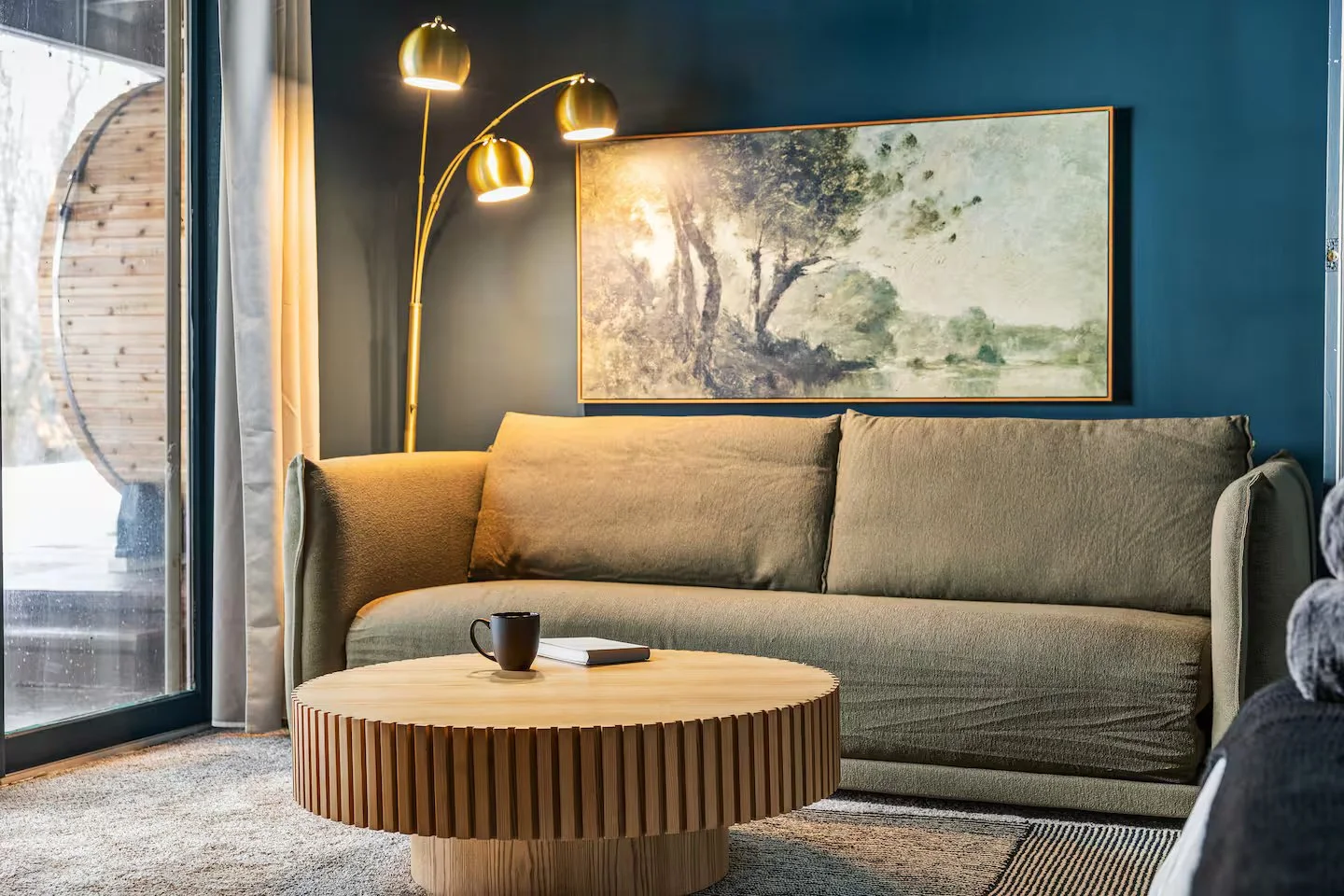 Downstairs, “Bedroom 4” offers a tranquil retreat with a king-size bed, a cozy fireplace, and a queen-size Koala pullout sofa sleeper. A workstation with a desk and chair adds convenience, while direct patio access leads right to the relaxing jacuzzi